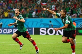 RECIFE, BRAZIL - JUNE 23:  Andres Guardado  (L)  and Javier Hernandez of Mexico celebrate their team's second goal during the 2014 FIFA World Cup Brazil Group A match between Croatia and Mexico at Arena Pernambuco on June 23, 2014 in Recife, Brazil.  (Pho
