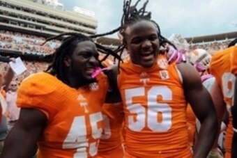 Oct 19, 2013; Knoxville, TN, USA; Tennessee Volunteers linebacker A.J. Johnson (45) and linebacker Curt Maggitt (56) celebrate after defeating the South Carolina Gamecocks at Neyland Stadium. Tennessee won 23 to 21.  Mandatory Credit: Randy Sartin-USA TOD