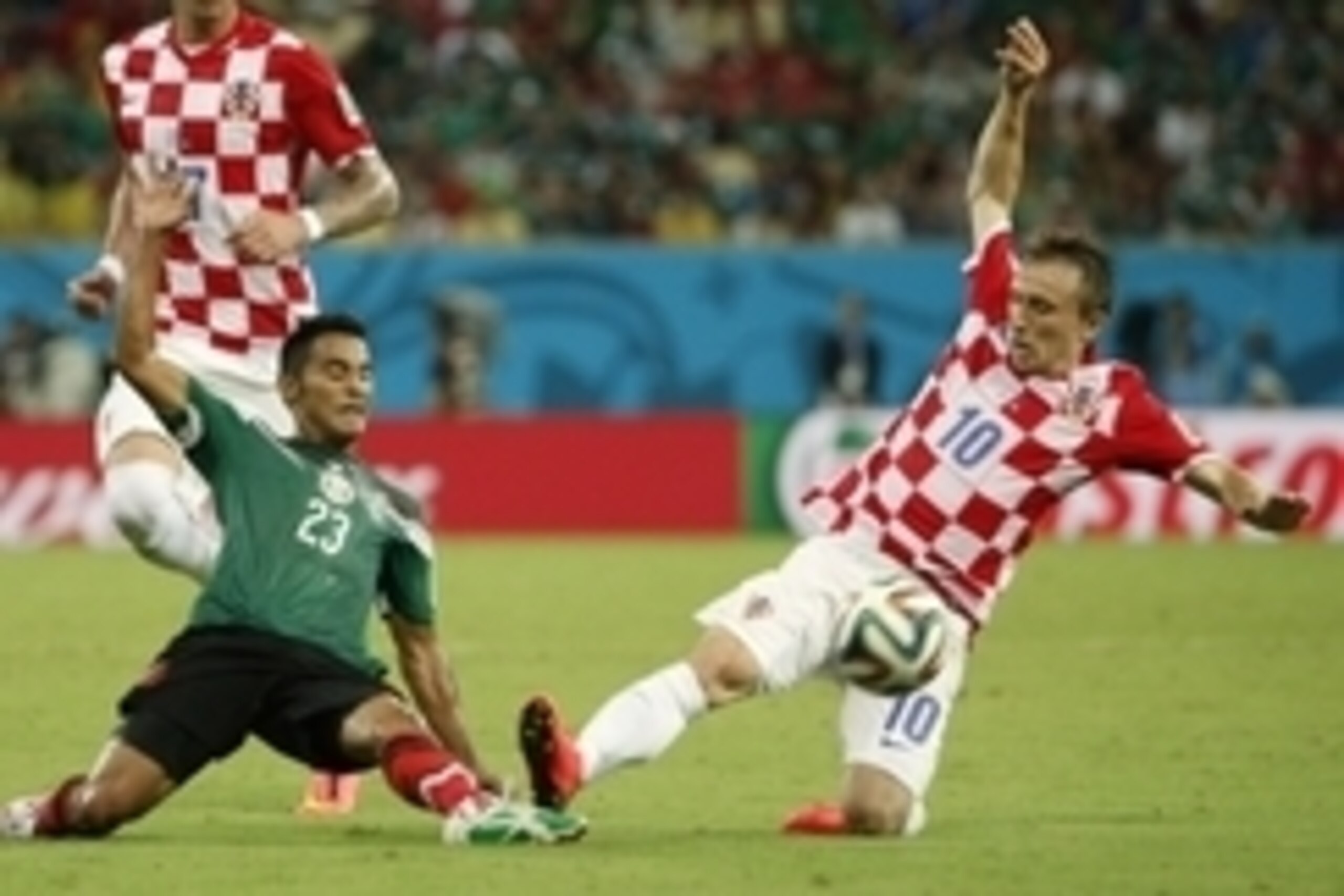 Jun 23, 2014; Recife, Pernambuco, BRAZIL; Mexico midfielder Jose Vazquez (23) and Croatia midfielder Luka Modric (10) battle for the ball during the first half of a 2014 World Cup game at Arena Pernambuco. Mandatory Credit: Winslow Townson-USA TODAY Sport