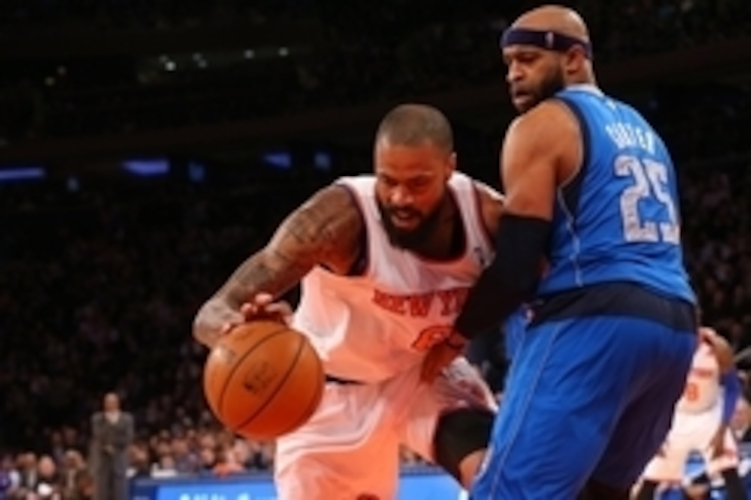 Feb 24, 2014; New York, NY, USA;  New York Knicks center Tyson Chandler (6) dribbles the ball around Dallas Mavericks shooting guard Vince Carter (25) during the third quarter at Madison Square Garden. Dallas Mavericks won 110-108.  Mandatory Credit: Anth