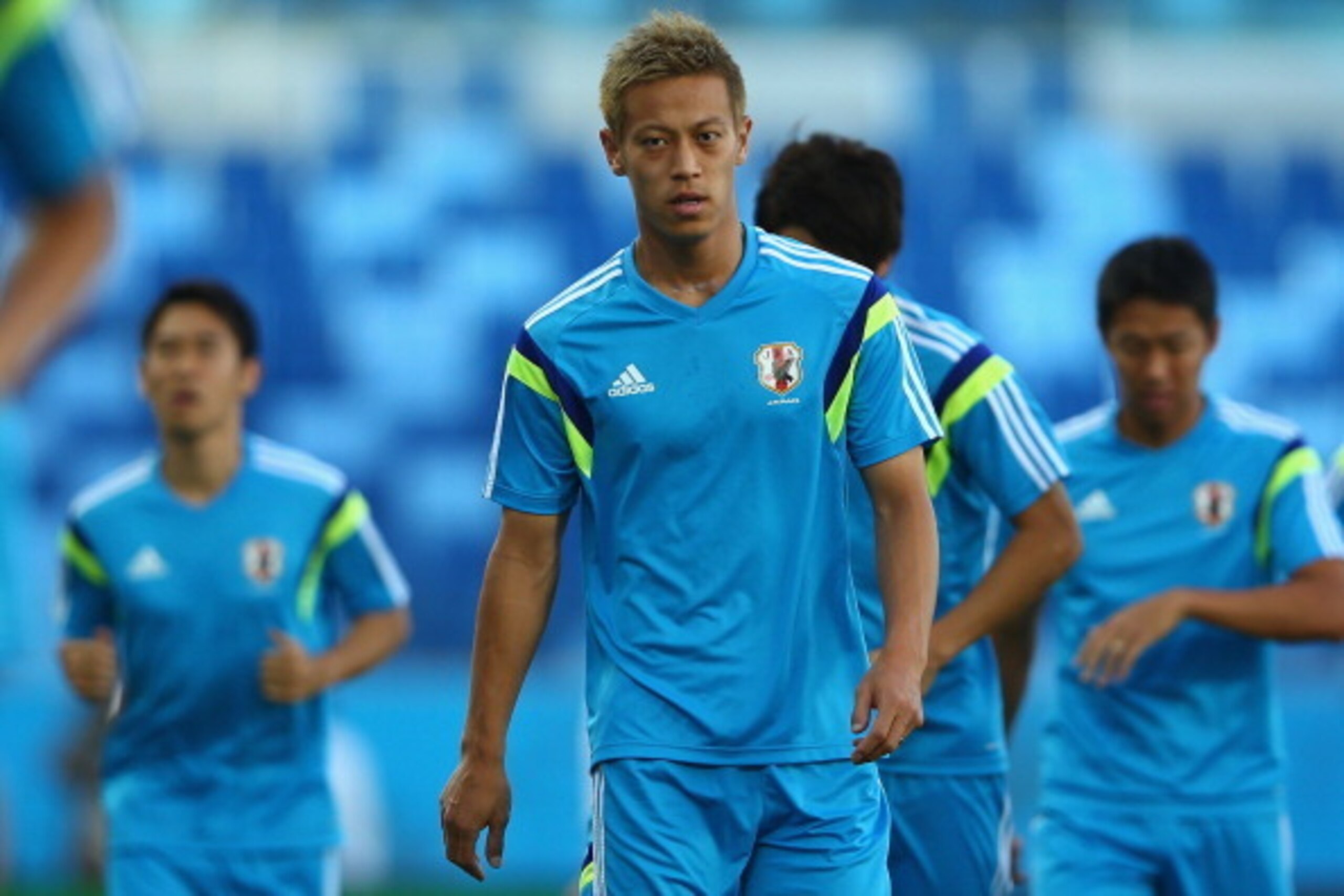 CUIABA, BRAZIL - JUNE 23:  Keisuke Honda looks on during a Japan training session at Arena Pantanal on June 23, 2014 in Cuiaba, Mato Grosso.  (Photo by Mark Kolbe/Getty Images)