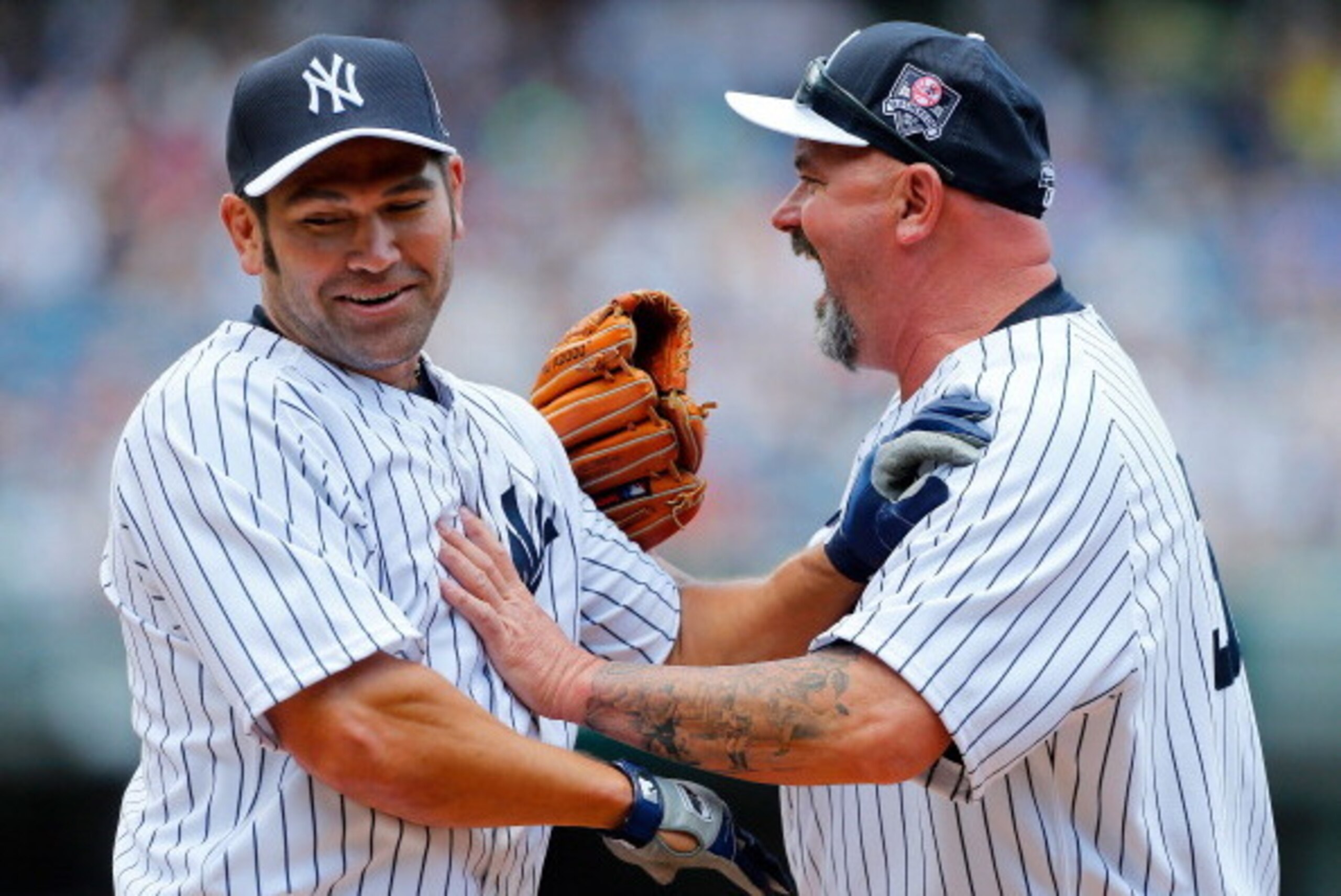 NEW YORK, NY - JUNE 22:  Former New York Yankees Johnny Damon (L) and David Wells a laugh during the teams Old Timers Day prior to a game between the New York Yankees and the Baltimore Orioles at Yankee Stadium on June 22, 2014 in the Bronx borough of New