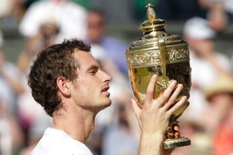 LONDON, ENGLAND - JULY 07:  Andy Murray of Great Britain poses with the Gentlemen's Singles Trophy following his victory in the Gentlemen's Singles Final match against Novak Djokovic of Serbia on day thirteen of the Wimbledon Lawn Tennis Championships at 