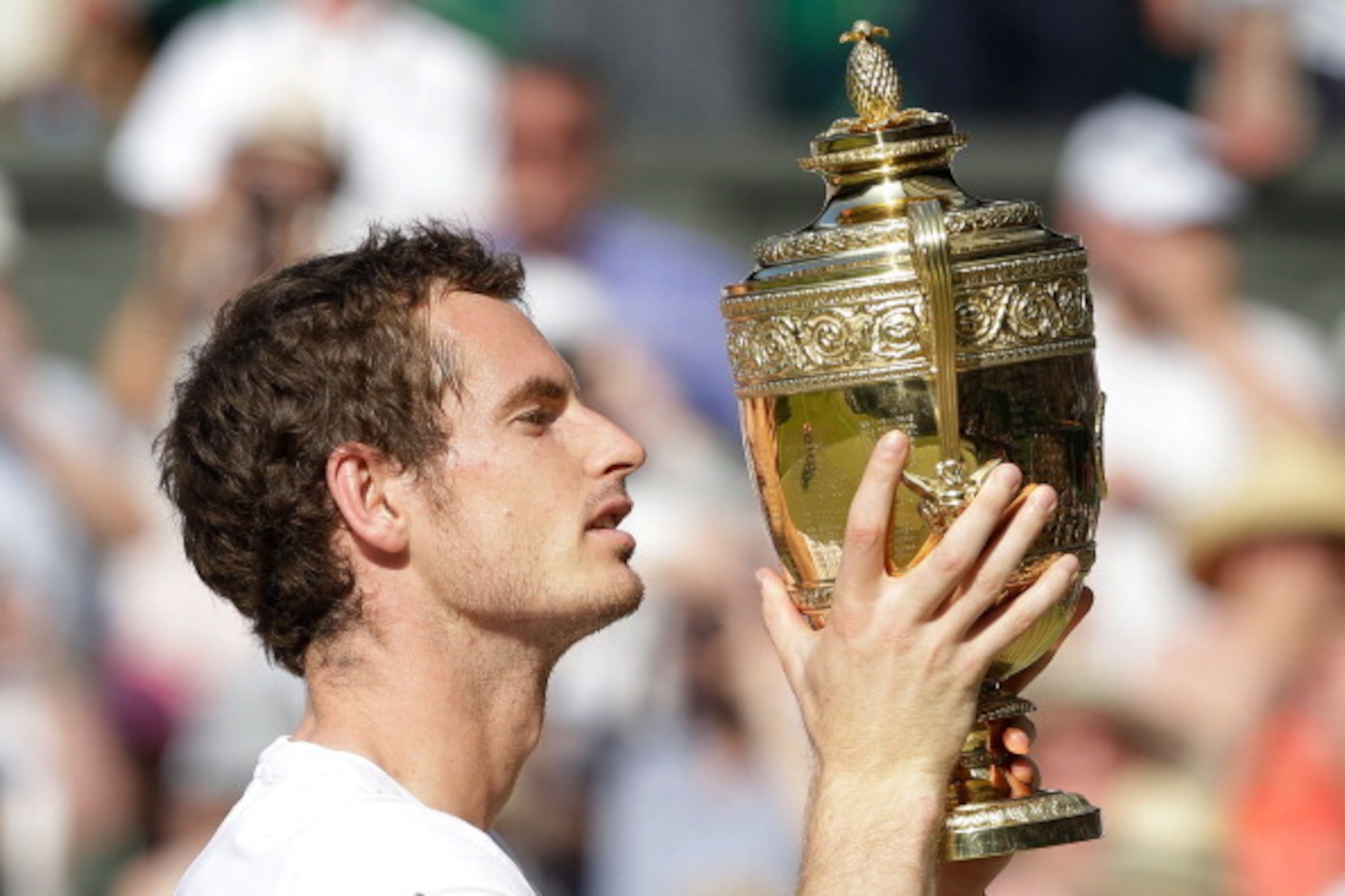 LONDON, ENGLAND - JULY 07: Andy Murray of Great Britain poses with the Gentlemen's Singles Trophy following his victory in the Gentlemen's Singles Final match against Novak Djokovic of Serbia on day thirteen of the Wimbledon Lawn Tennis Championships at LONDON, ENGLAND - JULY 07: Andy Murray of Great Britain poses with the Gentlemen's Singles Trophy following his victory in the Gentlemen's Singles Final match against Novak Djokovic of Serbia on day thirteen of the Wimbledon Lawn Tennis Championships at