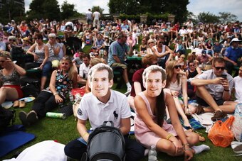 LONDON, ENGLAND - JUNE 23:  Fans of Andy Murray gather on 'Murray Mount' to watch the Gentlemen's Singles first round match between Andy Murray of Great Britain and David Goffin of Belgium on day one of the Wimbledon Lawn Tennis Championships at the All E