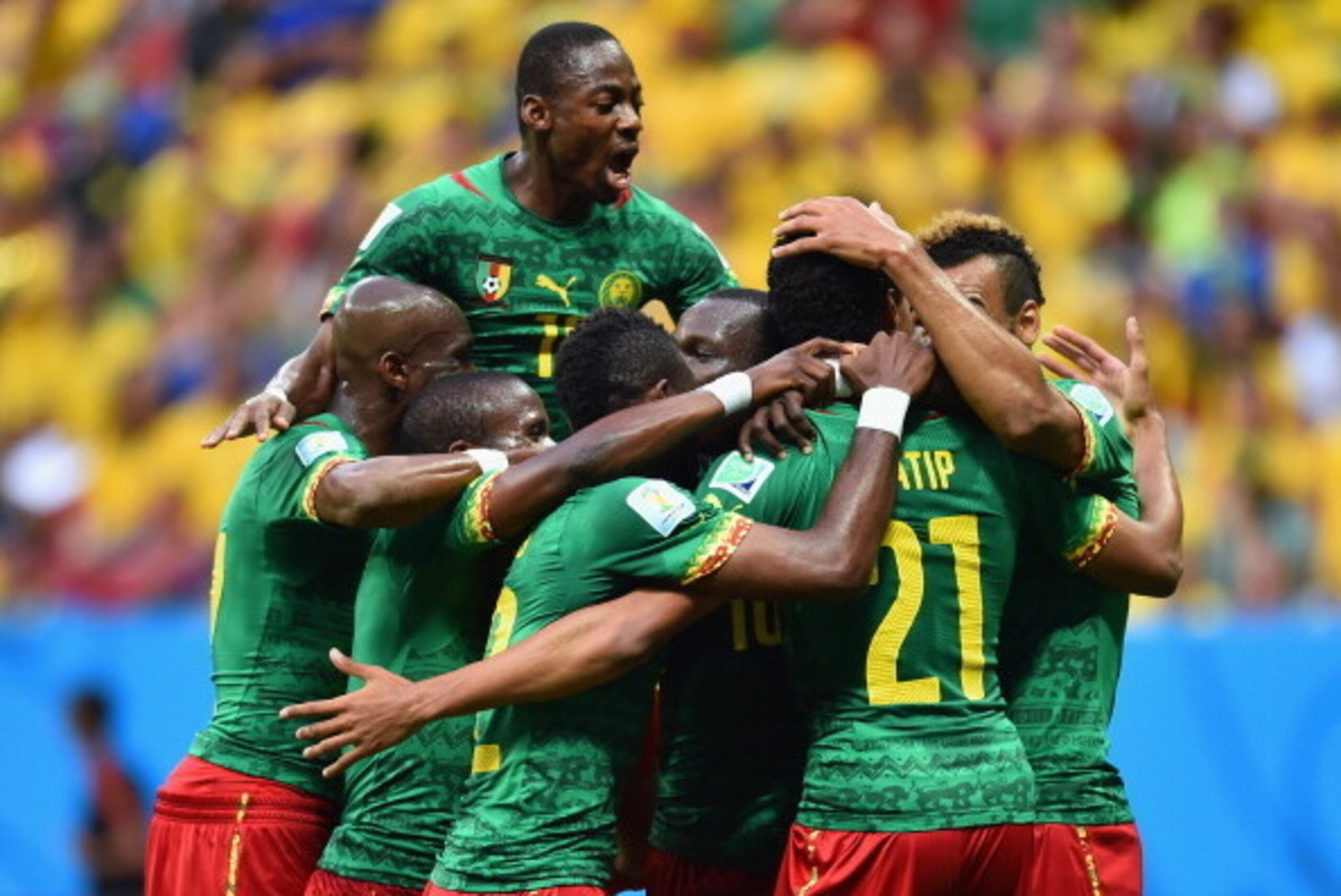BRASILIA, BRAZIL - JUNE 23:  Joel Matip of Cameroon (R) celebrates scoring his team's first goal with teammates during the 2014 FIFA World Cup Brazil Group A match between Cameroon and Brazil at Estadio Nacional on June 23, 2014 in Brasilia, Brazil.  (Pho