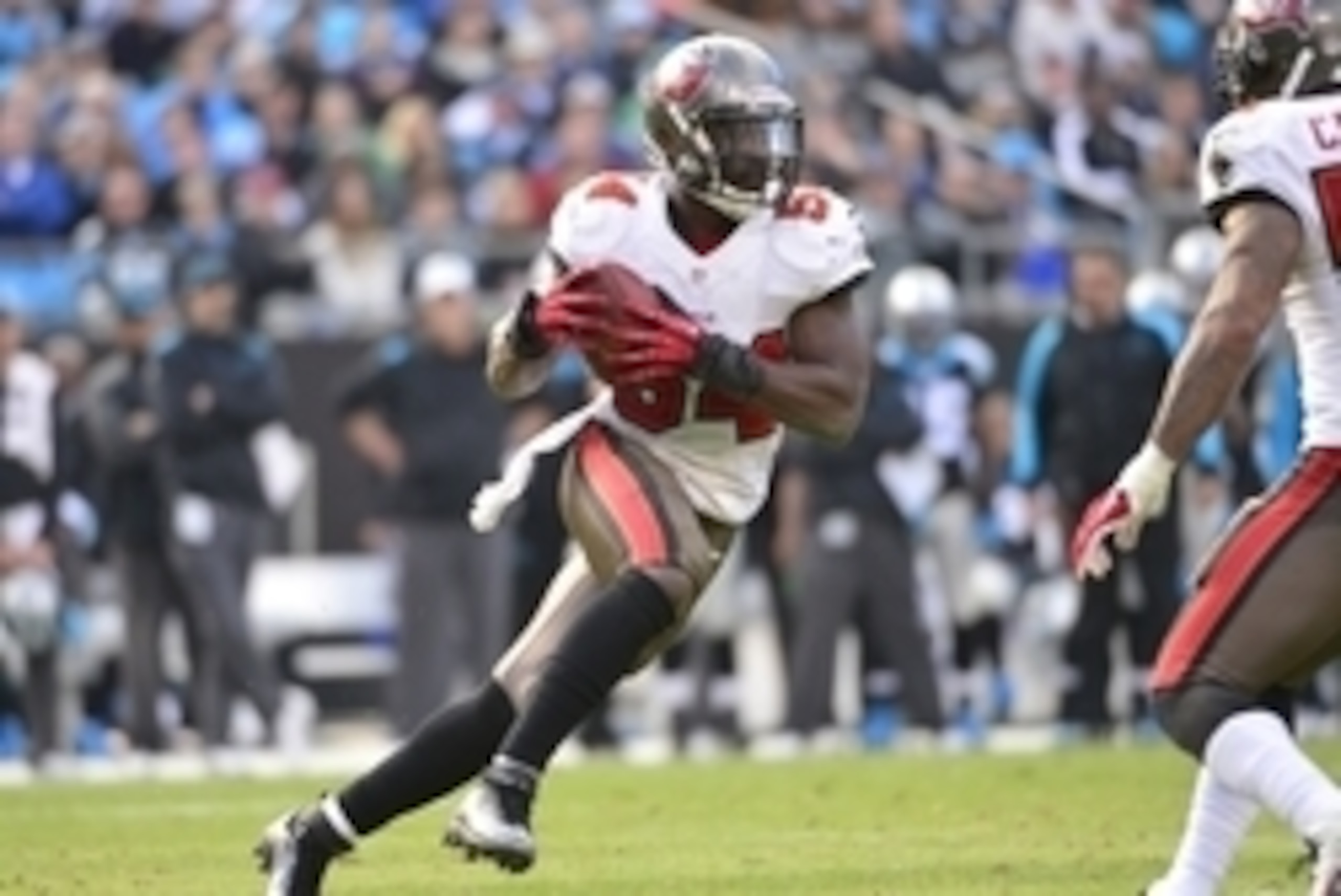 Dec 1, 2013; Charlotte, NC, USA; Tampa Bay Buccaneers outside linebacker Lavonte David (54) runs after intercepting a pass in the third quarter. The Carolina Panthers defeated the Tampa Bay Buccaneers 27-6 at Bank of America Stadium. Mandatory Credit: Bob