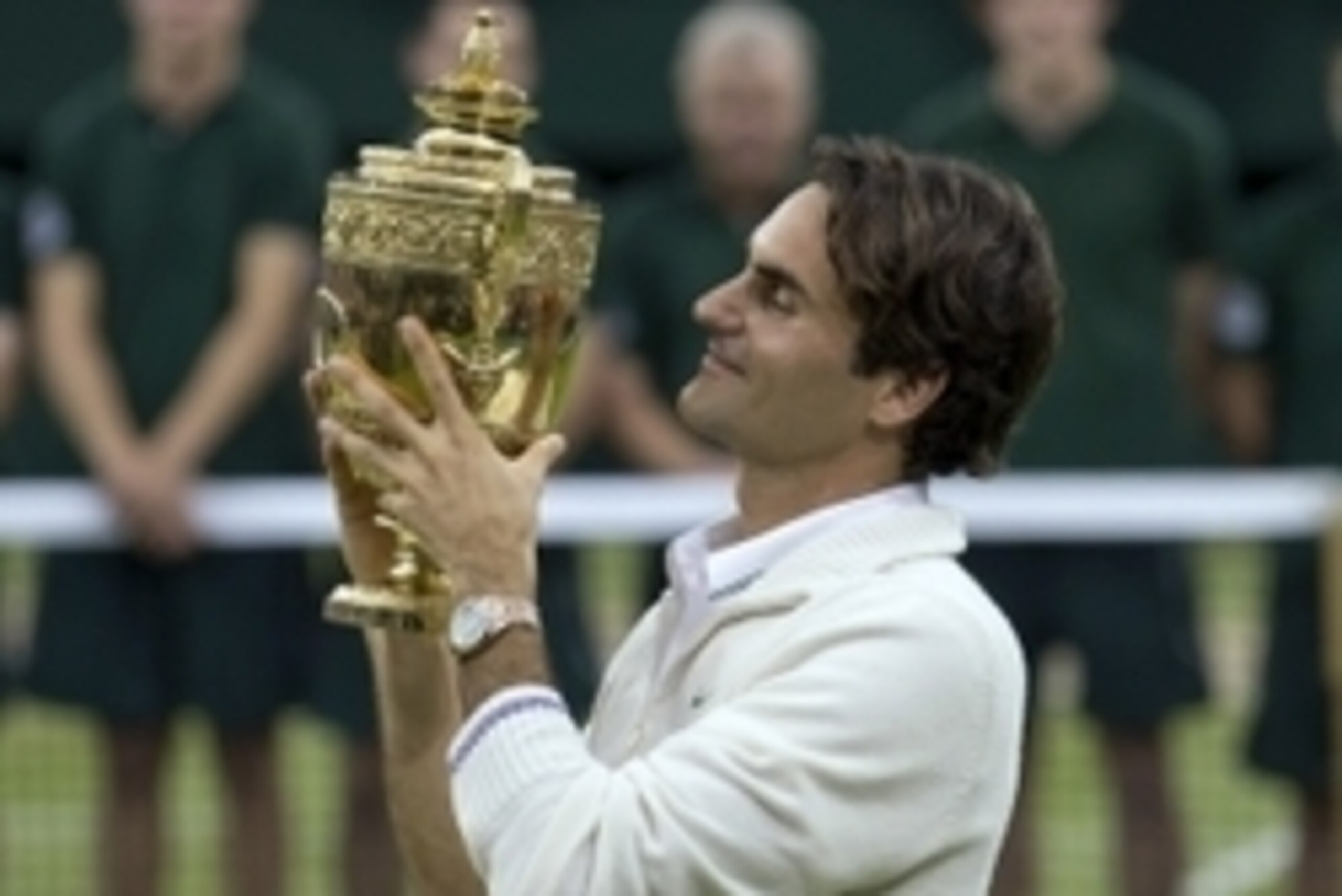 July 8, 2012; London, UNITED KINGDOM; Roger Federer (SUI) at the trophy presentation on day 13 of the 2012 Wimbledon Championships at the All England Lawn Tennis Club. Federer won 4-6 7-5 6-3 6-4. Mandatory Credit: Susan Mullane-USA TODAY Sports