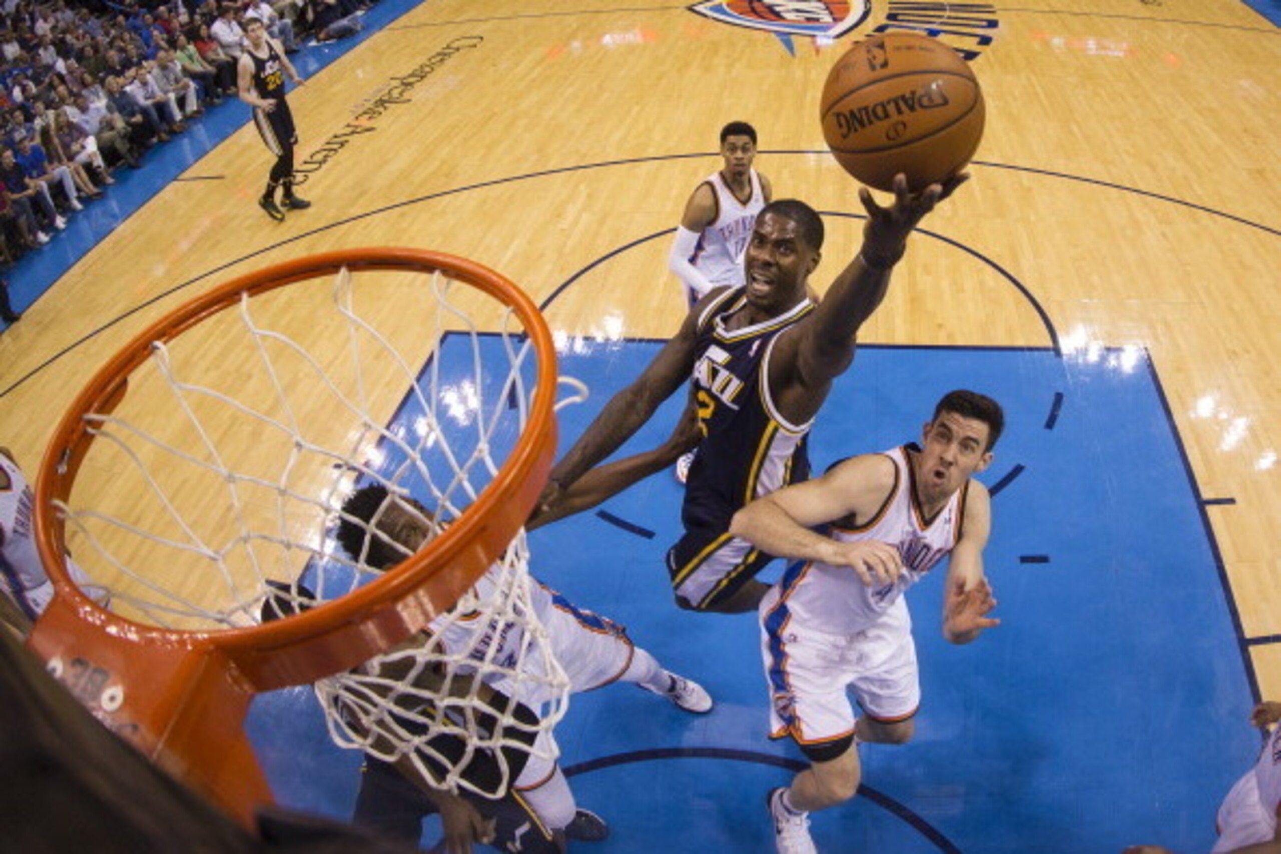 OKLAHOMA CITY, OK - MARCH 30: Marvin Williams #2 of the Utah Jazz drives to the basket against the Oklahoma City Thunder- at the Chesapeake Arena on March 30, 2014 in Oklahoma City, Oklahoma. NOTE TO USER:  User expressly acknowledges and agrees that, by 