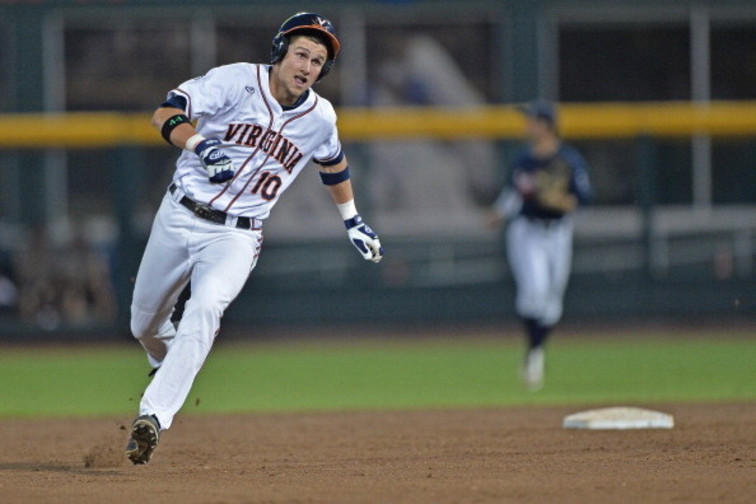 Omaha, NE - JUNE 23: Center fielder Brandon Downs #10 of the Virginia Cavaliers triples against the Vanderbilt Commodores in the fifth inning during game one of the College World Series Championship on June 23, 2014 at TD Ameritrade Park in Omaha, Nebrask