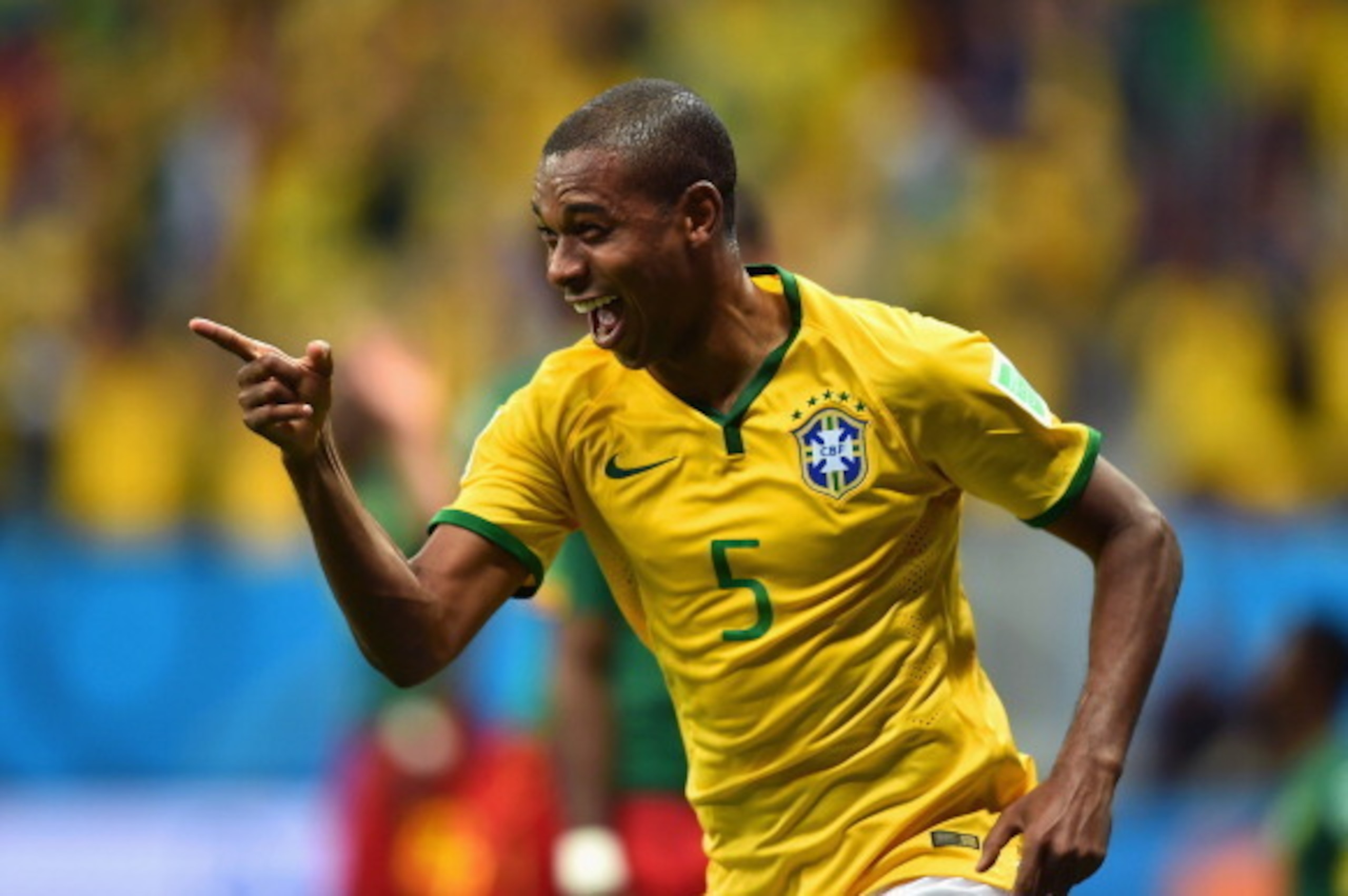 BRASILIA, BRAZIL - JUNE 23:  Fernandinho of Brazil celebrates scoring his team's fourth goal during the 2014 FIFA World Cup Brazil Group A match between Cameroon and Brazil at Estadio Nacional on June 23, 2014 in Brasilia, Brazil.  (Photo by Buda Mendes/G