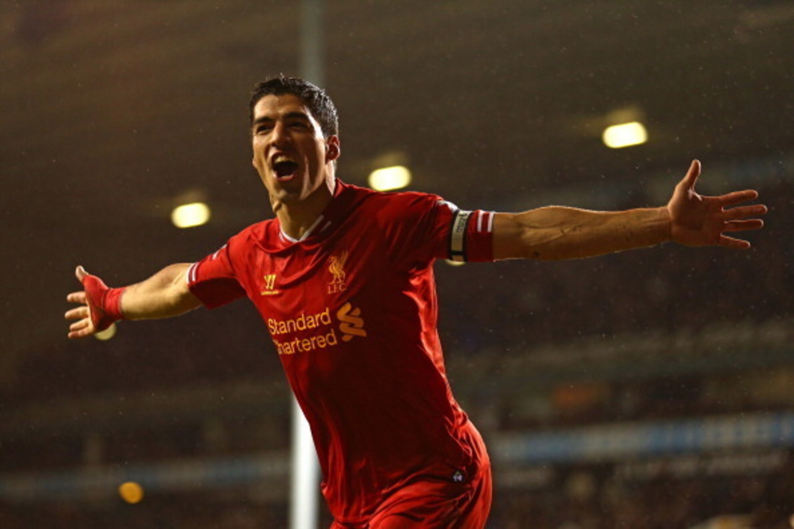 LONDON, ENGLAND - DECEMBER 15:  Luis Suarez of Liverpool celebrates scoring their fourth goal during the Barclays Premier League match between Tottenham Hotspur and Liverpool at White Hart Lane on December 15, 2013 in London, England.  (Photo by Paul Gilh