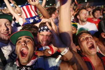 RIO DE JANEIRO, BRAZIL - JUNE 22:  American fans celebrate after the U.S. scored to take a 2-1 lead over Portugal while watching a video broadcast at the FIFA Fan Fest on Copacabana Beach during the 2014 FIFA World Cup Brazil on June 22, 2014 in Rio de Ja