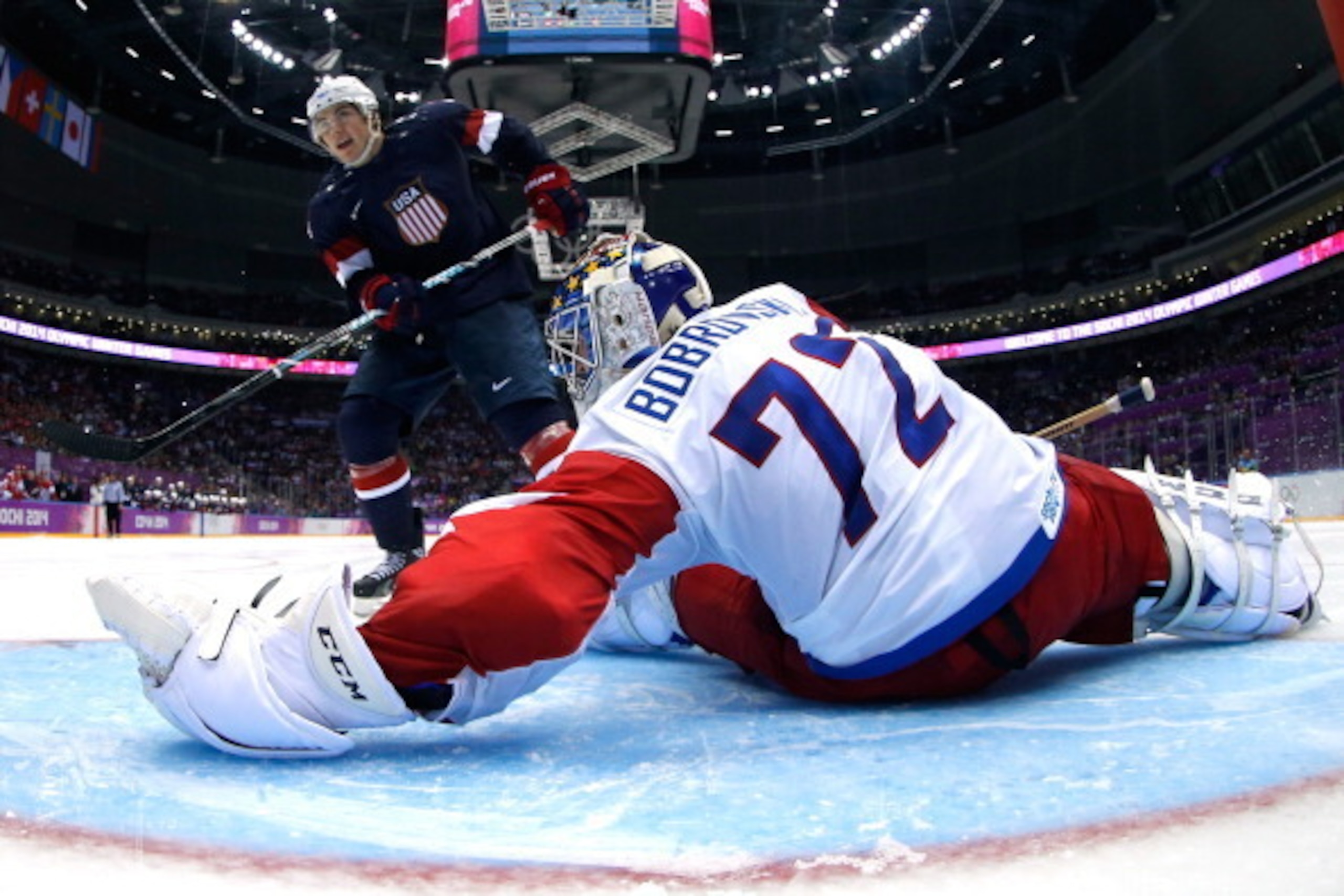 SOCHI, RUSSIA - FEBRUARY 15: T.J. Oshie #74 of the United States shoots on a shootout against Sergei Bobrovski #72 of Russia during the Men's Ice Hockey Preliminary Round Group A game on day eight of the Sochi 2014 Winter Olympics at Bolshoy Ice Dome on SOCHI, RUSSIA - FEBRUARY 15: T.J. Oshie #74 of the United States shoots on a shootout against Sergei Bobrovski #72 of Russia during the Men's Ice Hockey Preliminary Round Group A game on day eight of the Sochi 2014 Winter Olympics at Bolshoy Ice Dome on