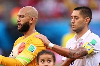 MANAUS, BRAZIL - JUNE 22: Goalkeeper Tim Howard (L) and Clint Dempsey of the United States look on during the National Anthem prior to the 2014 FIFA World Cup Brazil Group G match between the United States and Portugal at Arena Amazonia on June 22, 2014 i