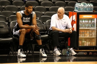 SAN ANTONIO, TX JUNE 04: Tim Duncan #21 and head coach Gregg Popovich of the San Antonio Spurs talk during practice as part of the 2014 NBA Finals on June 04, 2014 at AT&T Center in San Antonio, Texas. NOTE TO USER: User expressly acknowledges and agrees 