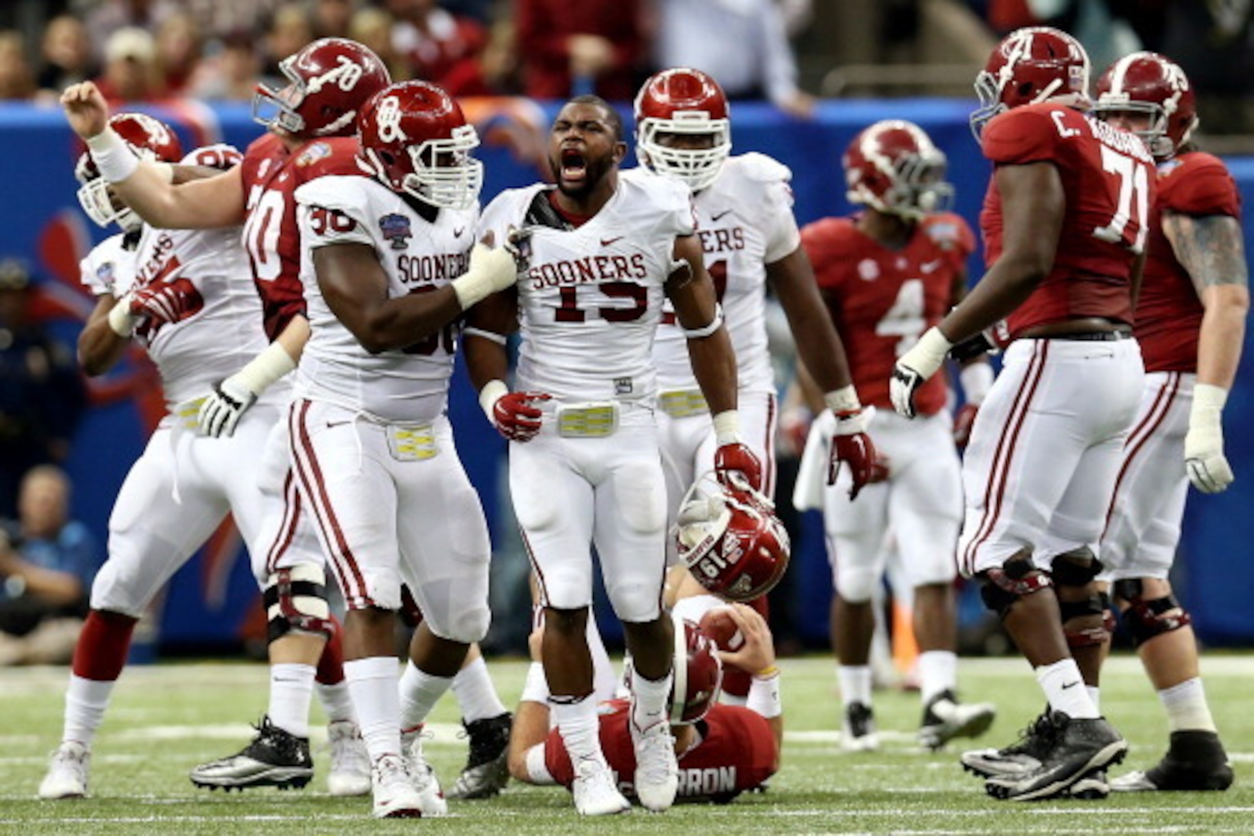 NEW ORLEANS, LA - JANUARY 02:  Eric Striker #19 of the Oklahoma Sooners celebrates after sacking AJ McCarron #10 of the Alabama Crimson Tide during the Allstate Sugar Bowl at the Mercedes-Benz Superdome on January 2, 2014 in New Orleans, Louisiana.  (Phot