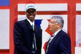 NEW YORK - JUNE 26:  Kobe Bryant poses with NBA Commissioner David Stern after being selected in the first round of the 1996 NBA Draft on June 26, 1996 at Madison Square Garden in New York, New York. NOTE TO USER: User expressly acknowledges that, by down