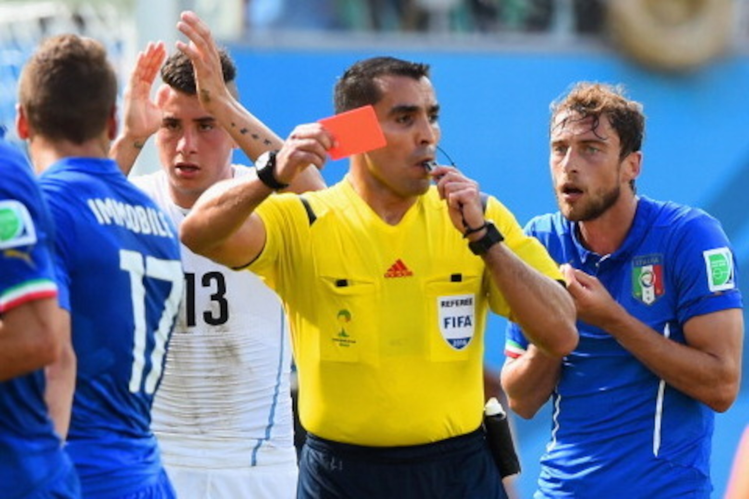 NATAL, BRAZIL - JUNE 24:  Referee Marco Rodriguez shows a red card to Claudio Marchisio of Italy during the 2014 FIFA World Cup Brazil Group D match between Italy and Uruguay at Estadio das Dunas on June 24, 2014 in Natal, Brazil.  (Photo by Matthias Hang