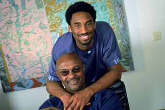 LOS ANGELES - NOVEMEBER:  Guard Kobe Bryant #8 of the Los Angeles Lakers poses for a portrait with his father, former NBA player Joe 'Jellybean' Bryant, after purchasing a 50 percent interest in Olimpia Milano, the Italian League team his father once play