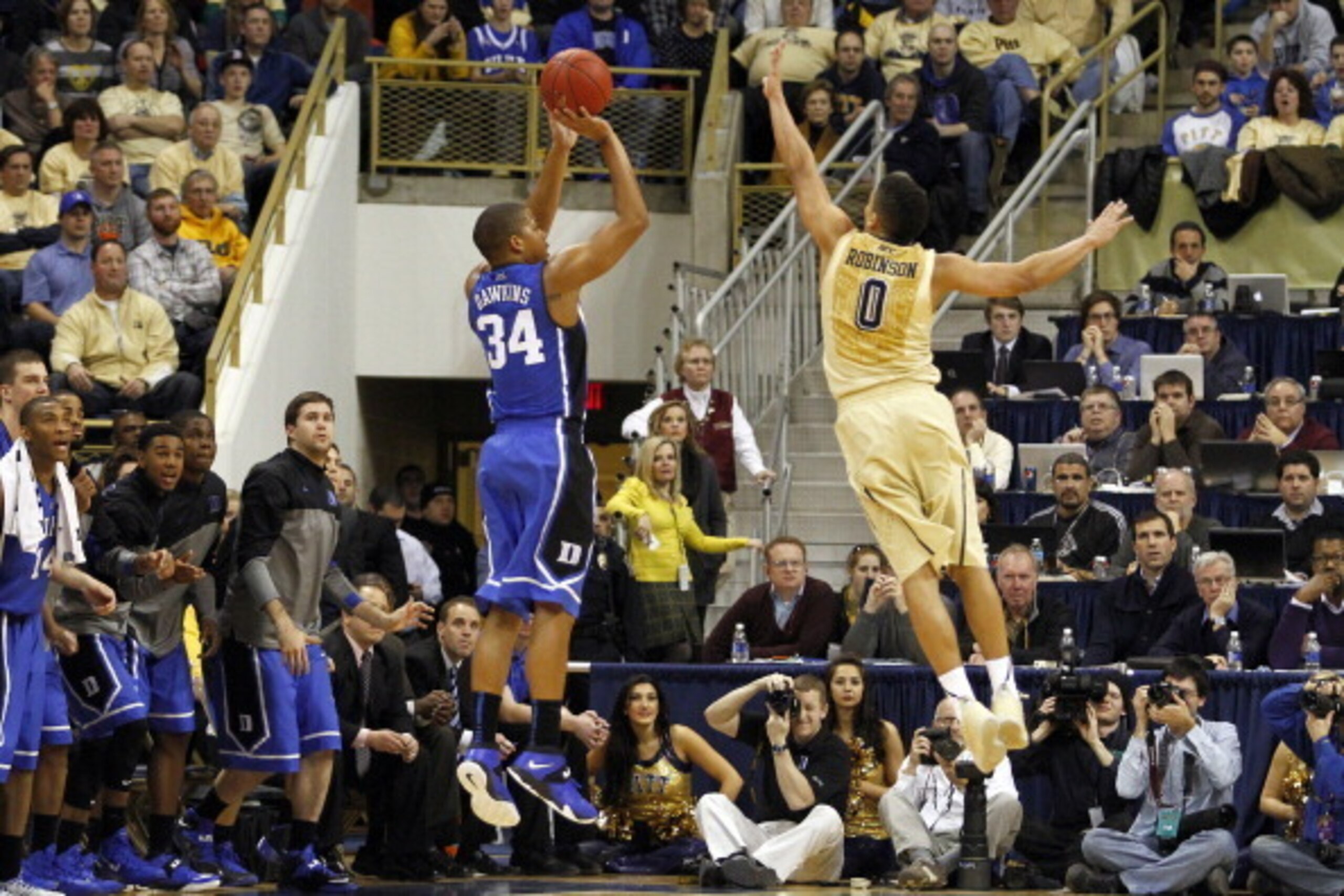 PITTSBURGH, PA - JANUARY 27:  Andre Dawkins #34 of the Duke Blue Devils pulls up for a three-point shot against James Robinson #0 of the Pittsburgh Panthers at Petersen Events Center on January 27, 2014 in Pittsburgh, Pennsylvania.  (Photo by Justin K. Al
