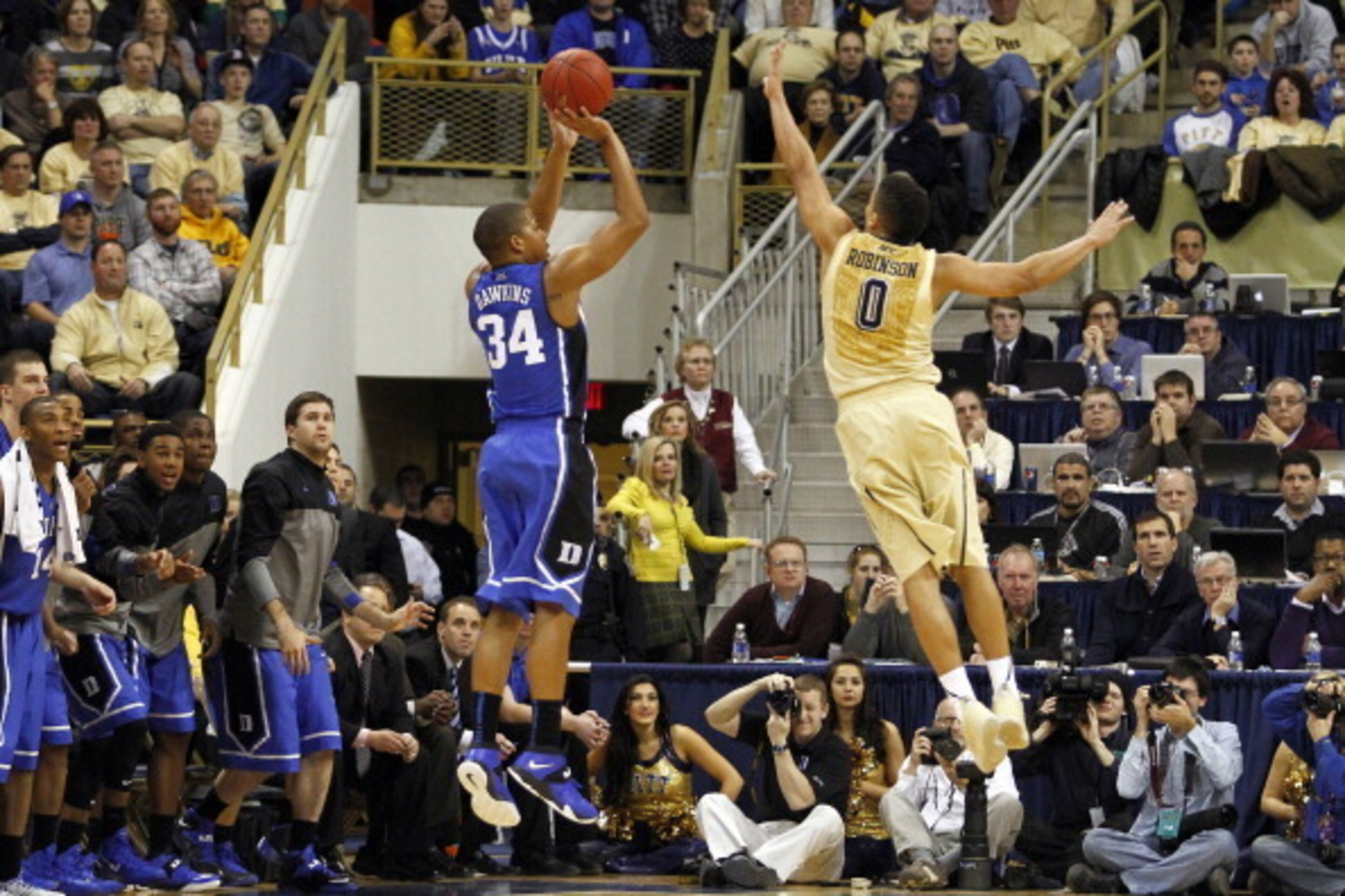 PITTSBURGH, PA - JANUARY 27:  Andre Dawkins #34 of the Duke Blue Devils pulls up for a three-point shot against James Robinson #0 of the Pittsburgh Panthers at Petersen Events Center on January 27, 2014 in Pittsburgh, Pennsylvania.  (Photo by Justin K. Al