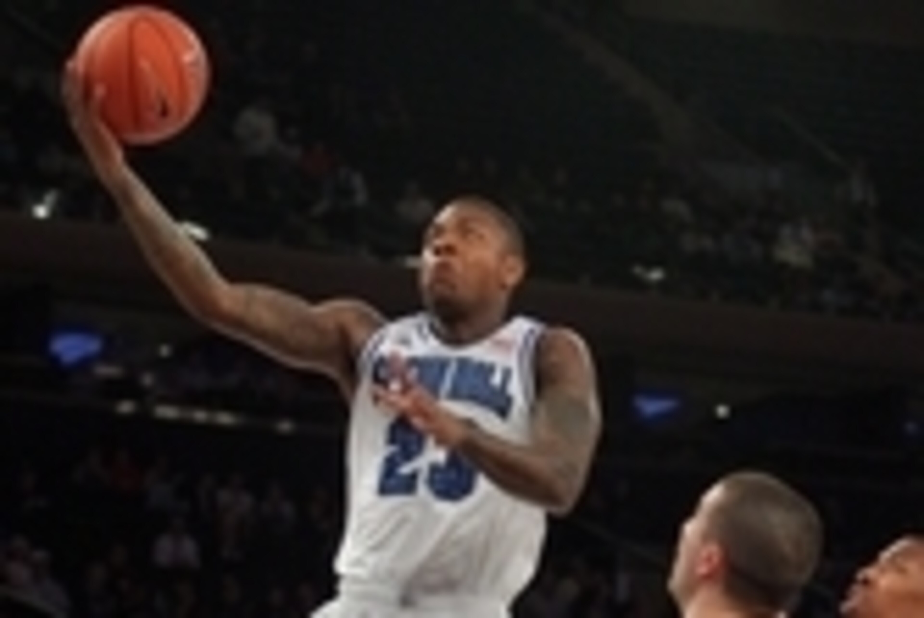 Mar 12, 2014; New York, NY, USA; Seton Hall Pirates guard/forward Fuquan Edwin (23) shoots the ball in front of Butler Bulldogs forward Andrew Chrabascz (45) during the first half in the first round of the Big East tournament at Madison Square Garden. Man