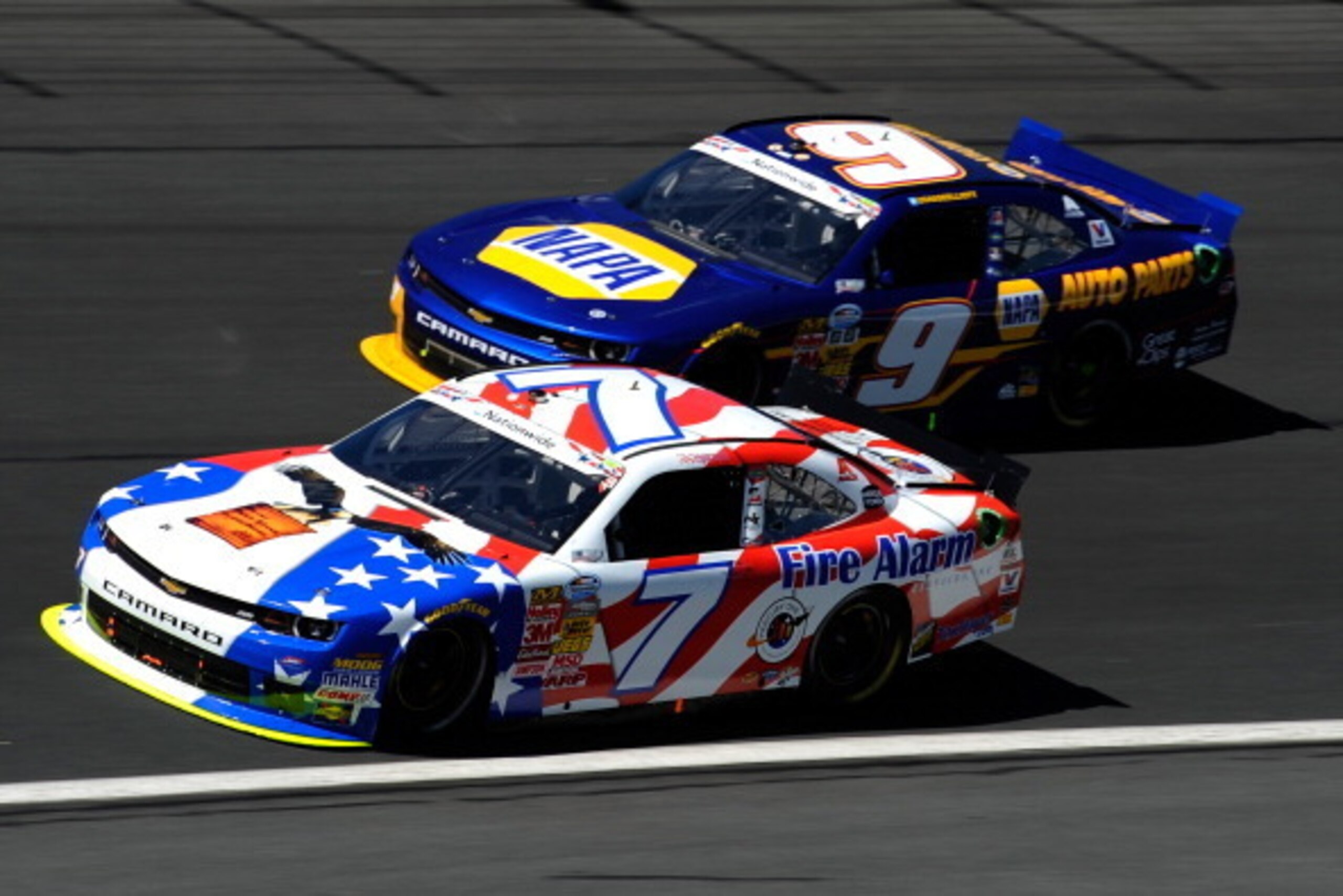 CHARLOTTE, NC - MAY 24:  Regan Smith, driver of the #7 Fire Alarm Services Chevrolet, leads Chase Elliott, driver of the #9 NAPA AUTO PARTS Chevrolet, during qualifying for the NASCAR Nationwide Series History 300 at Charlotte Motor Speedway on May 24, 20