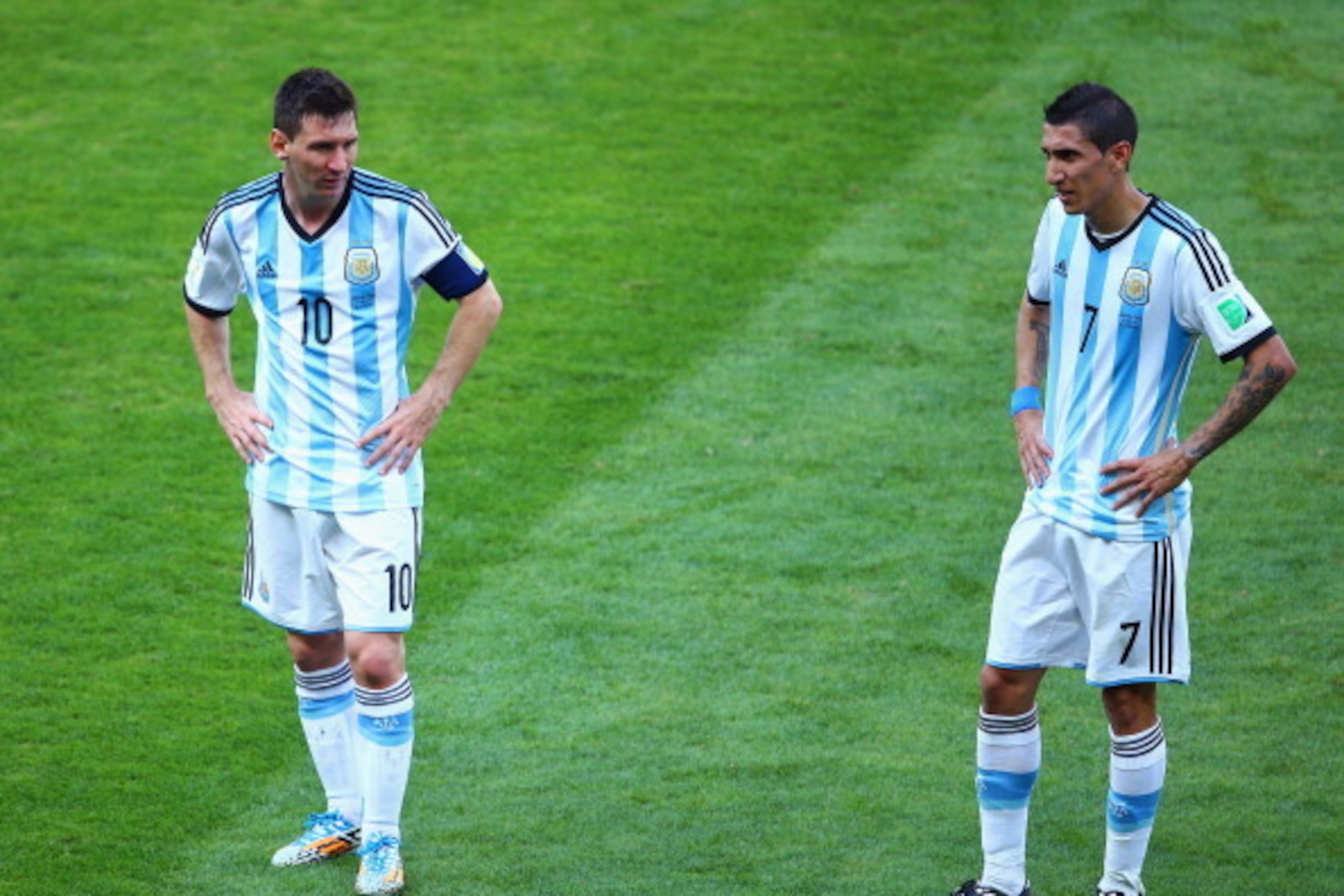 BELO HORIZONTE, BRAZIL - JUNE 21: Lionel Messi (L) and Angel di Maria of Argentina look on during the 2014 FIFA World Cup Brazil Group F match between Argentina and Iran at Estadio Mineirao on June 21, 2014 in Belo Horizonte, Brazil.  (Photo by Ian Walton