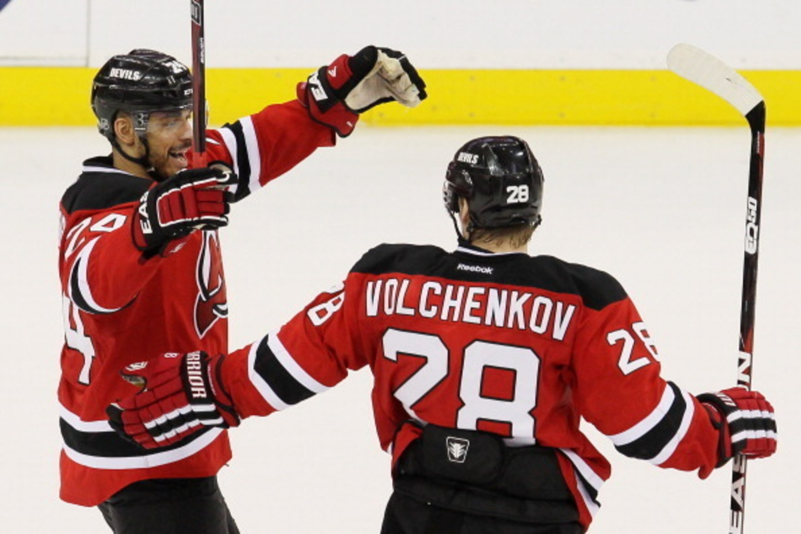 NEWARK, NJ - MAY 21:  Bryce Salvador #24 of the New Jersey Devils celebrates with Anton Volchenkov #28 of the New Jersey Devils in Game Four of the Eastern Conference Final during the 2012 NHL Stanley Cup Playoffs at the Prudential Center on May 21, 2012 