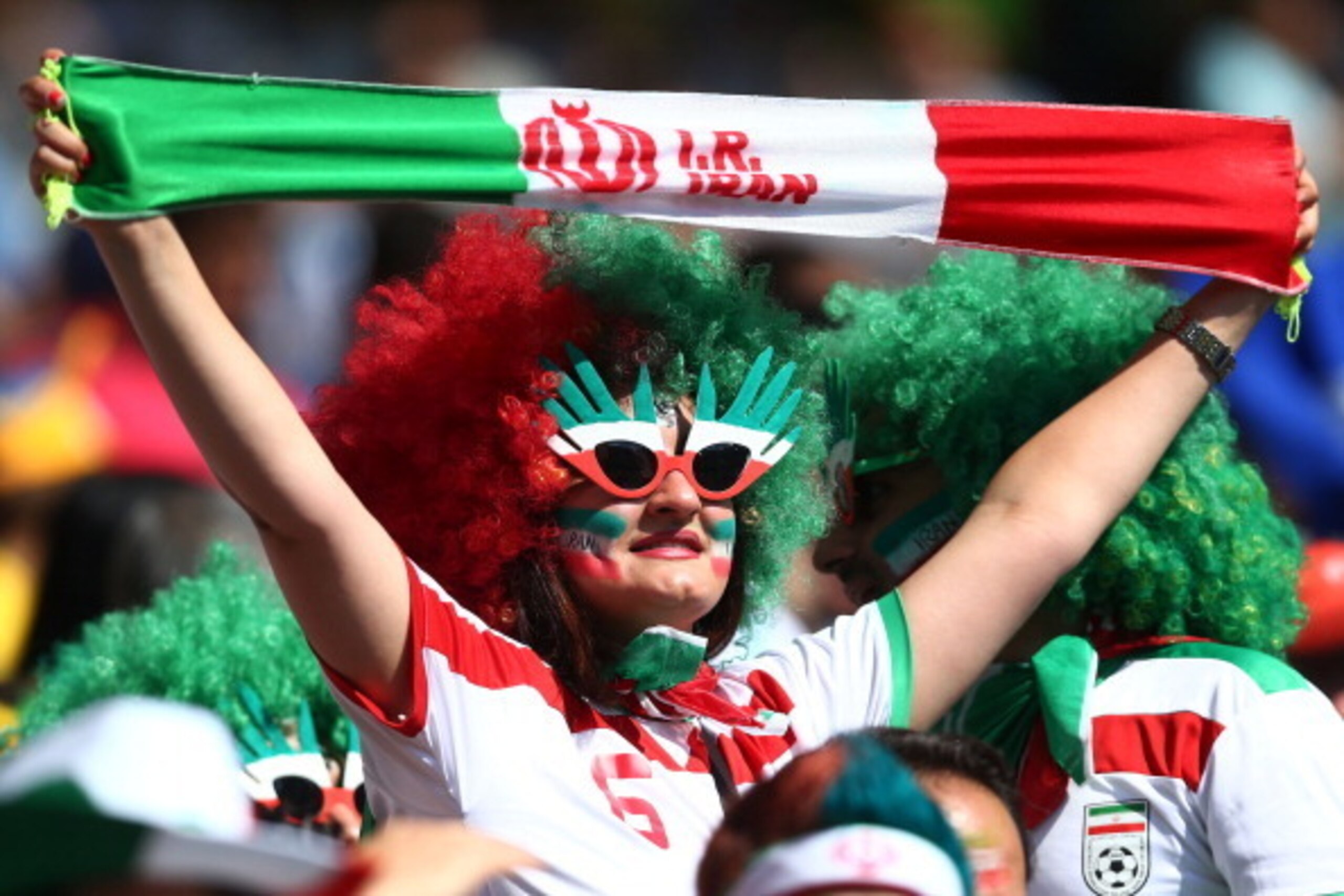 BELO HORIZONTE, BRAZIL - JUNE 21:  An Iran fan cheers during the 2014 FIFA World Cup Brazil Group F match between Argentina and Iran at Estadio Mineirao on June 21, 2014 in Belo Horizonte, Brazil.  (Photo by Jeff Gross/Getty Images)