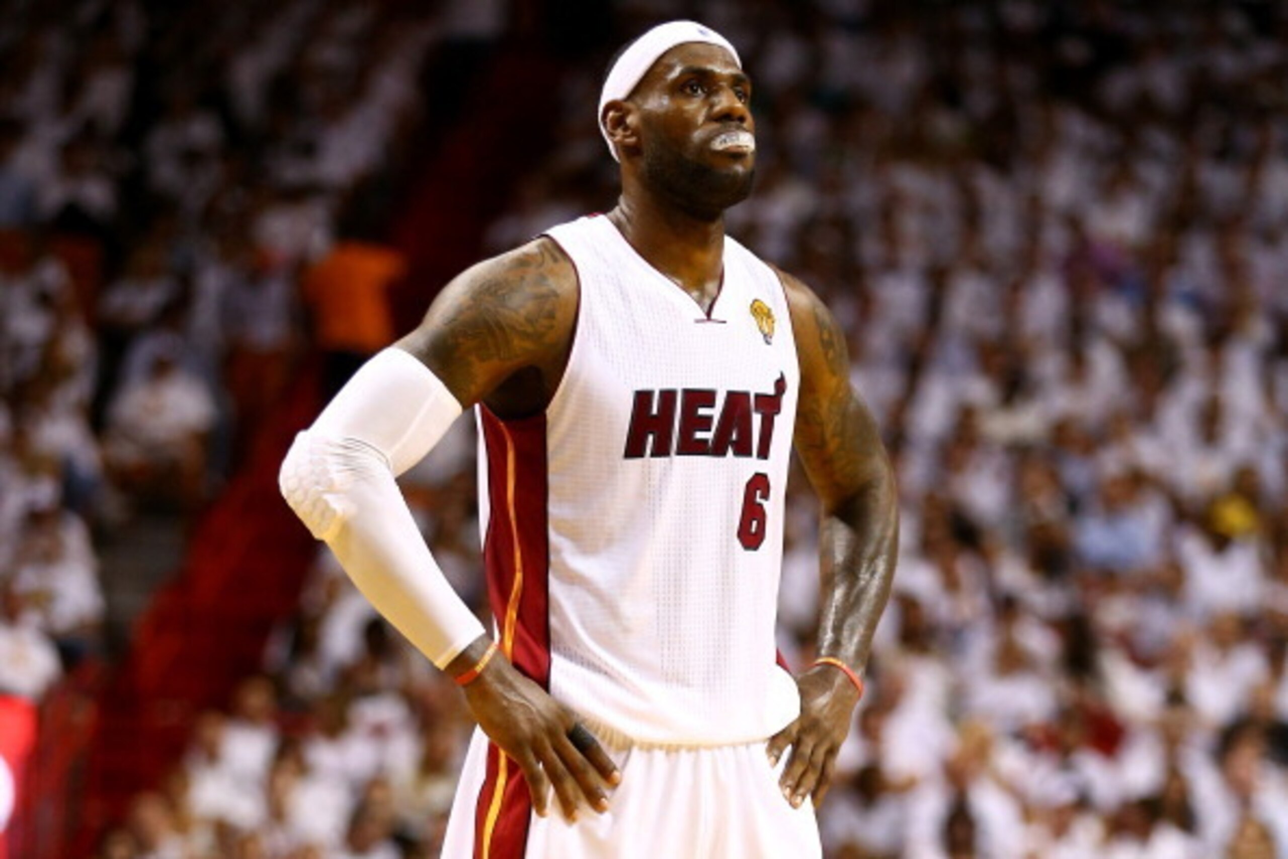 MIAMI, FL - JUNE 12:  LeBron James #6 of the Miami Heat looks on against the San Antonio Spurs during Game Four of the 2014 NBA Finals at American Airlines Arena on June 12, 2014 in Miami, Florida. NOTE TO USER: User expressly acknowledges and agrees that