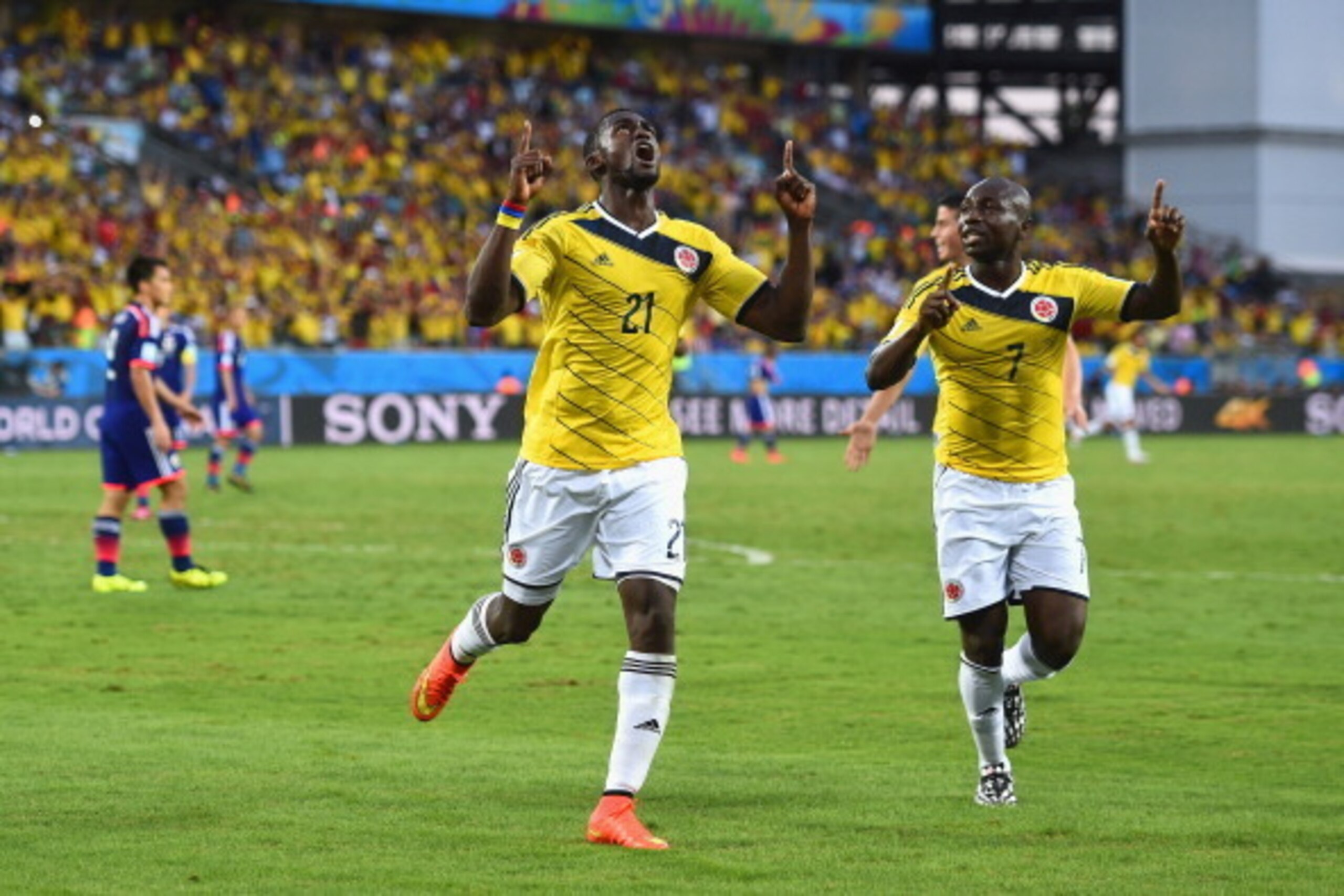 CUIABA, BRAZIL - JUNE 24:  Jackson Martinez of Colombia (L) celebrates scoring his team's second goal during the 2014 FIFA World Cup Brazil Group C match between Japan and Colombia at Arena Pantanal on June 24, 2014 in Cuiaba, Brazil.  (Photo by Christoph