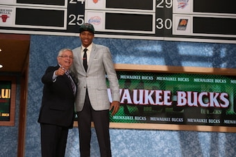 BROOKLYN, NY - JUNE 27: Giannis Antetokounmpo shakes hands with NBA Commissioner, David Stern after being selected number fifteen overall by the Milwaukee Bucks during the 2013 NBA Draft on June 27, 2013 at Barclays Center in Brooklyn, New York. NOTE TO U