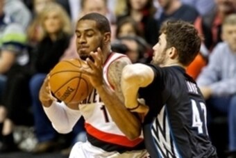 Jan 25, 2014; Portland, OR, USA; Portland Trail Blazers power forward LaMarcus Aldridge (12) drives to the basket against Minnesota Timberwolves power forward Kevin Love (42) during the first quarter at the Moda Center. Mandatory Credit: Craig Mitchelldye