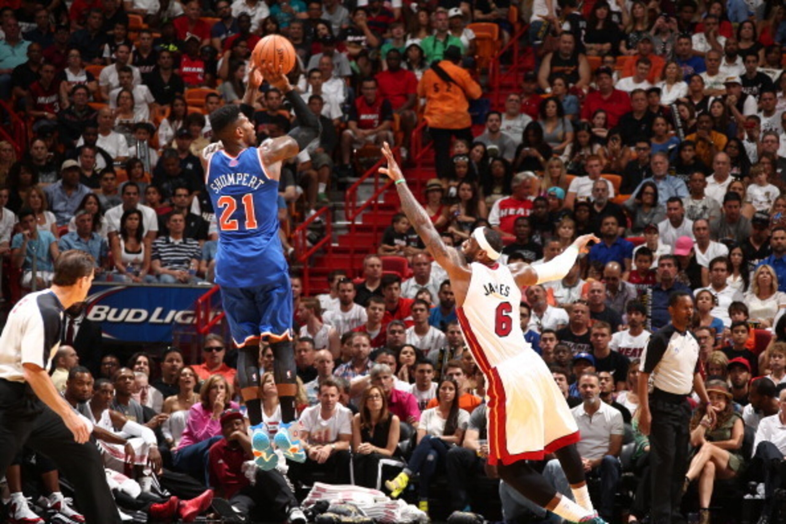 MIAMI, FL - APRIL 6: Iman Shumpert #21 of the New York Knicks shoots against LeBron James #6 of the Miami Heat during a game on April 6, 2014 at American Airlines Arena in Miami, Florida. NOTE TO USER: User expressly acknowledges and agrees that, by down MIAMI, FL - APRIL 6: Iman Shumpert #21 of the New York Knicks shoots against LeBron James #6 of the Miami Heat during a game on April 6, 2014 at American Airlines Arena in Miami, Florida. NOTE TO USER: User expressly acknowledges and agrees that, by down