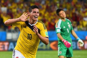 CUIABA, BRAZIL - JUNE 24:  James Rodriguez of Colombia celebrates scoring his team's fourth goal past goalkeeper Eiji Kawashima of Japan during the 2014 FIFA World Cup Brazil Group C match between Japan and Colombia at Arena Pantanal on June 24, 2014 in C