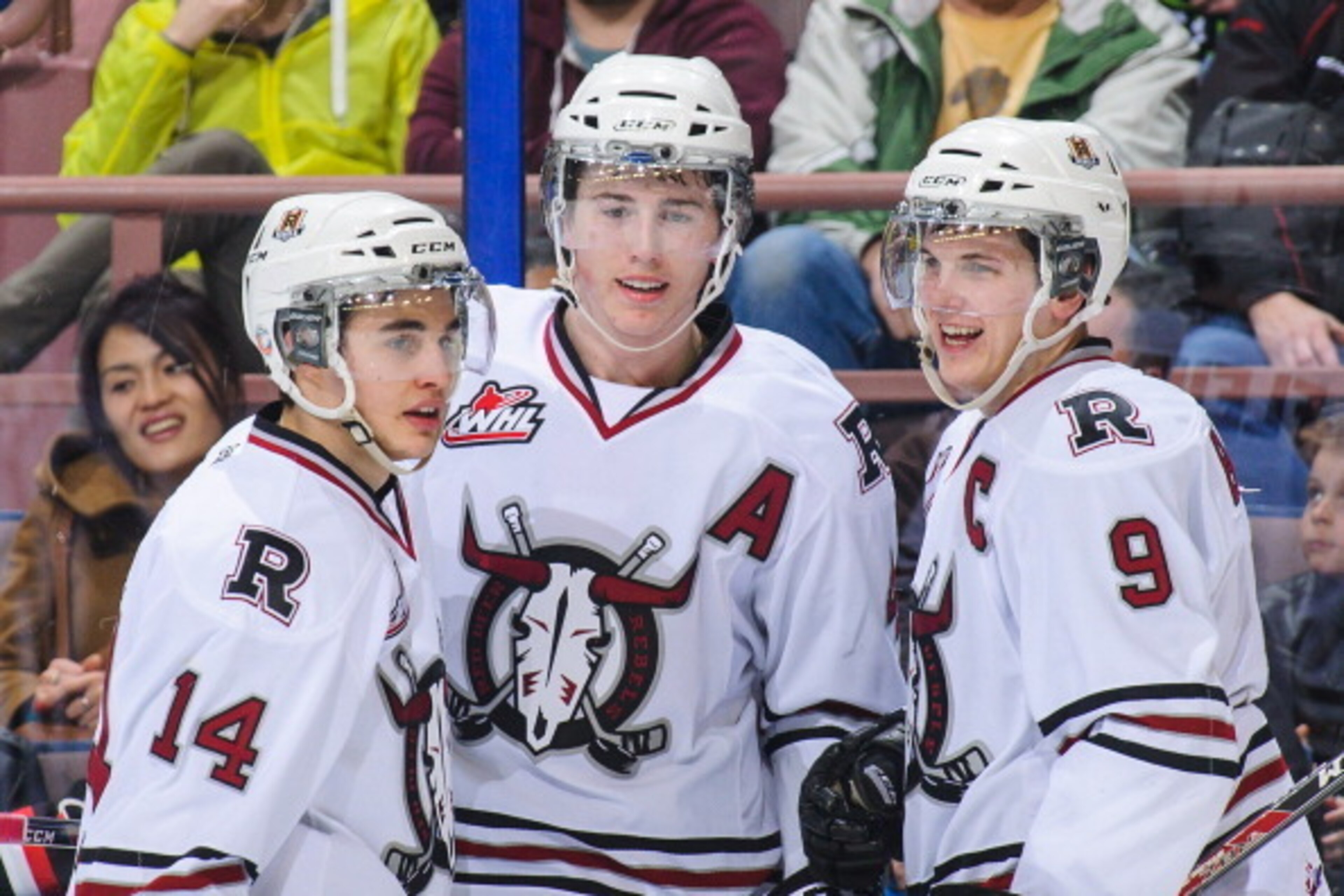EDMONTON, AB - MARCH 16: (L to R) Rhyse Dieno #14, Haydn Fleury #4, and Conner Bleackley #9 of the Red Deer Rebels celebrate Fleury's goal against the Edmonton Oil Kings during a WHL game at Rexall Place on March 16, 2014 in Edmonton, Alberta, Canada. (Ph