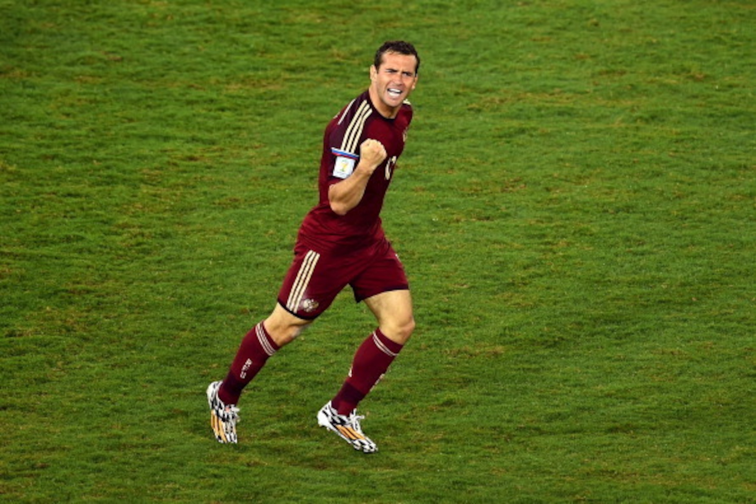 CUIABA, BRAZIL - JUNE 17:  Aleksandr Kerzhakov of Russia celebrates scoring his team's first goal during the 2014 FIFA World Cup Brazil Group H match between Russia and South Korea at Arena Pantanal on June 17, 2014 in Cuiaba, Brazil.  (Photo by Christoph