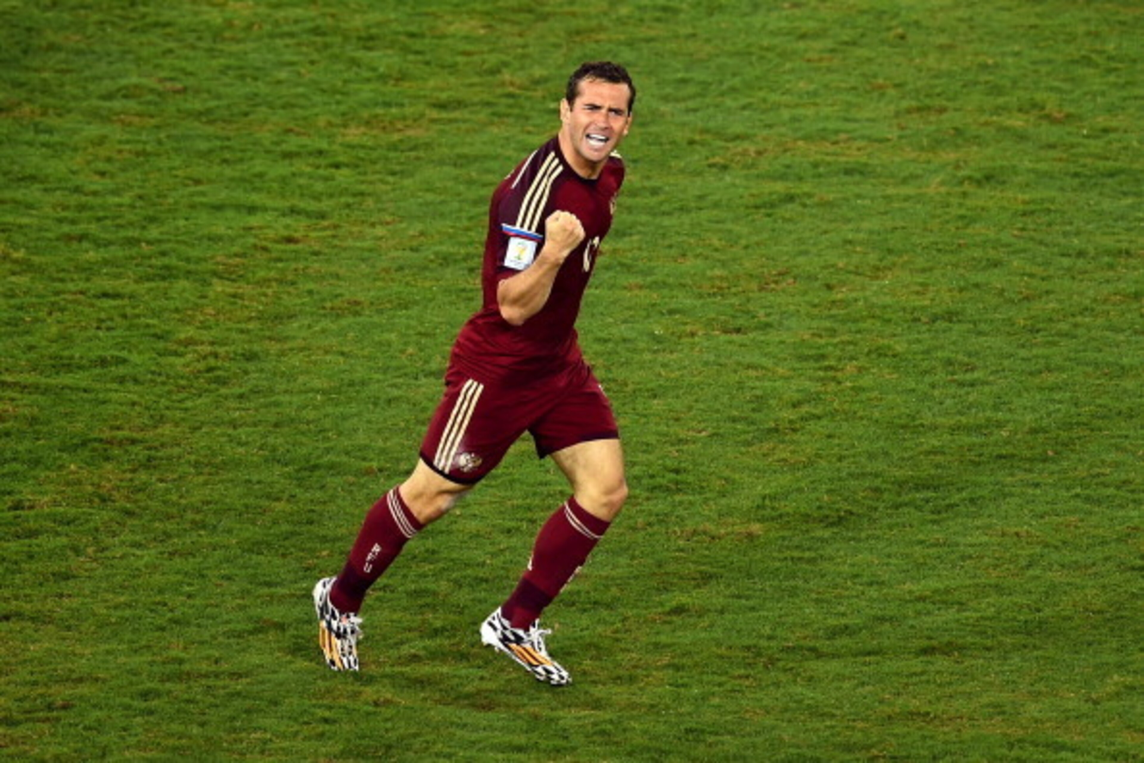 CUIABA, BRAZIL - JUNE 17: Aleksandr Kerzhakov of Russia celebrates scoring his team's first goal during the 2014 FIFA World Cup Brazil Group H match between Russia and South Korea at Arena Pantanal on June 17, 2014 in Cuiaba, Brazil. (Photo by Christoph CUIABA, BRAZIL - JUNE 17: Aleksandr Kerzhakov of Russia celebrates scoring his team's first goal during the 2014 FIFA World Cup Brazil Group H match between Russia and South Korea at Arena Pantanal on June 17, 2014 in Cuiaba, Brazil. (Photo by Christoph