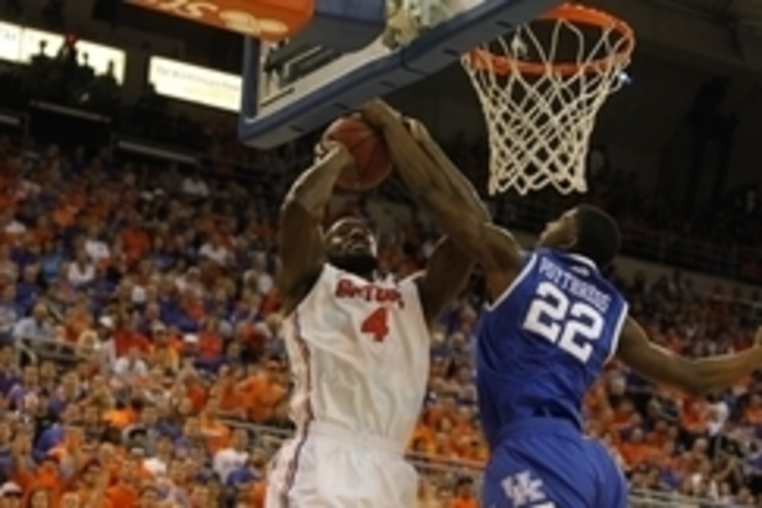 Mar 8, 2014; Gainesville, FL, USA; Kentucky Wildcats forward Alex Poythress (22) blocks Florida Gators center Patric Young (4) shot during the first half at Stephen C. O'Connell Center. Mandatory Credit: Kim Klement-USA TODAY Sports