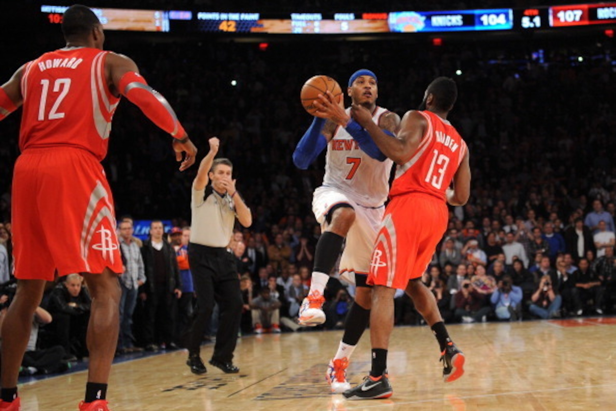 NEW YORK, NY - NOVEMBER 14: A personal foul is called on James Harden #13 of the Houston Rockets while  Carmelo Anthony #7 of the New York Knicks  takes a shot with five seconds left in the game at Madison Square Garden on November 14, 2013 in New York Ci