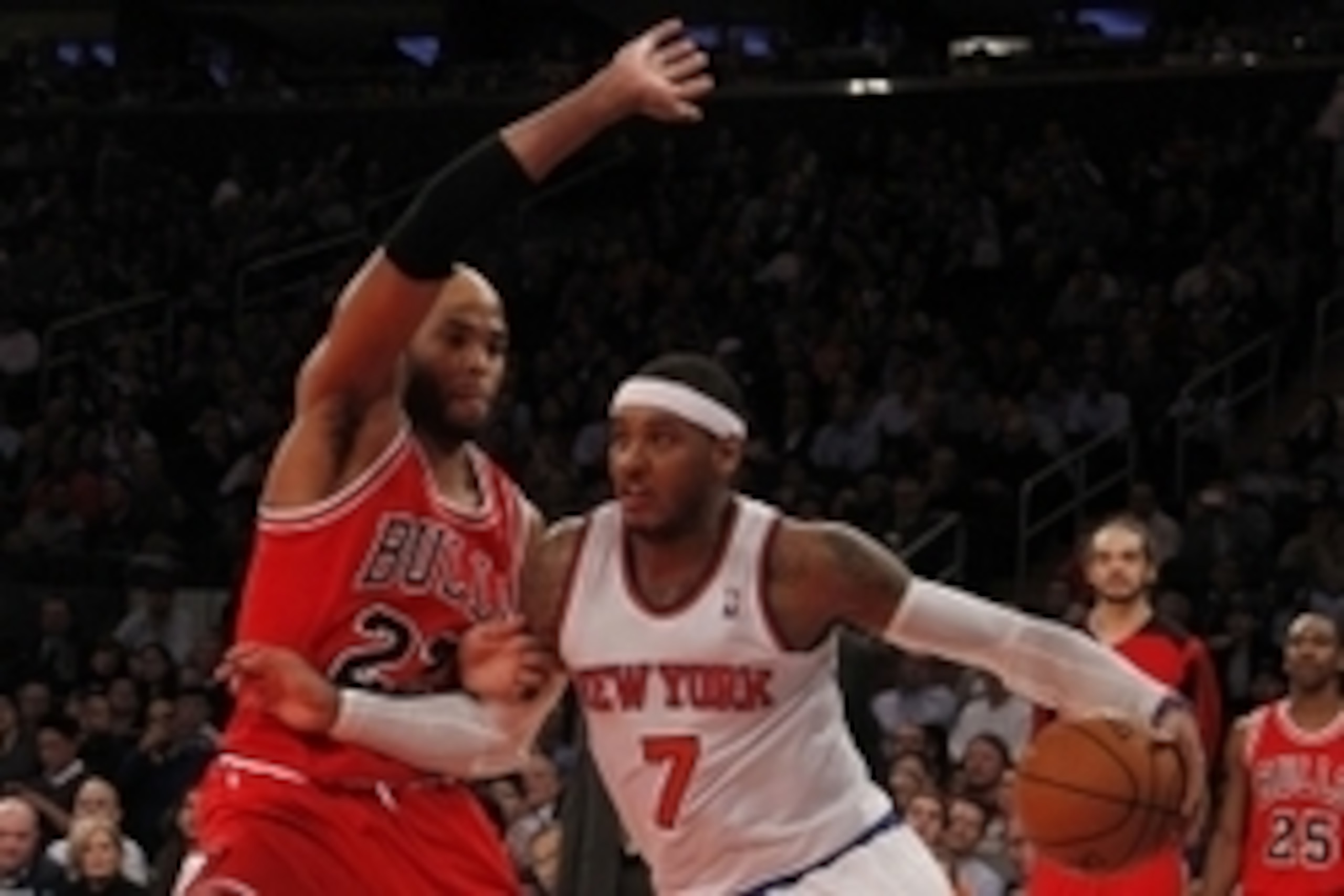 Dec 11, 2013; New York, NY, USA; Chicago Bulls power forward Taj Gibson (22) defends against New York Knicks small forward Carmelo Anthony (7) in the second half of NBA game at Madison Square Garden. Mandatory Credit: Noah K. Murray-USA TODAY Sports