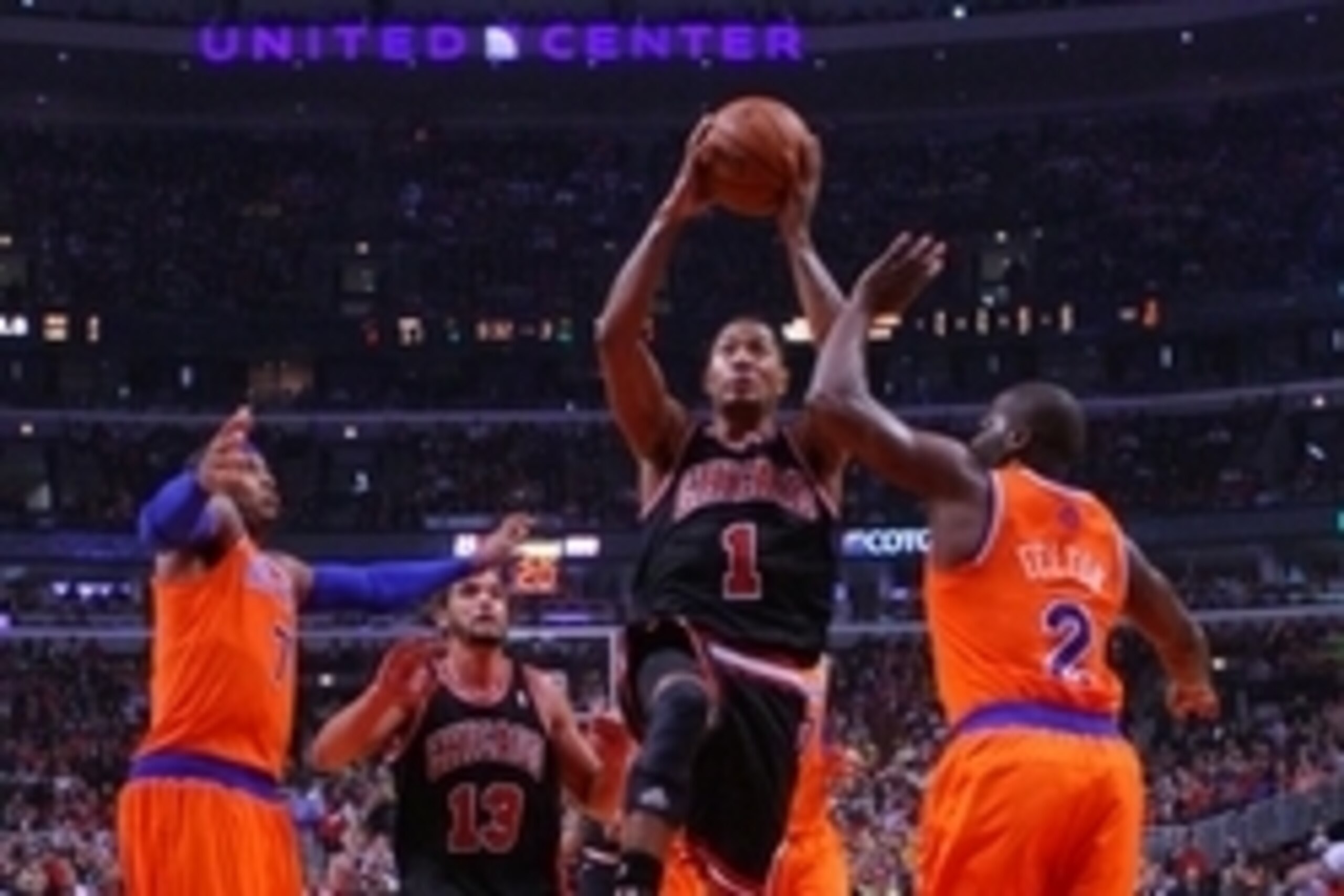 Oct 31, 2013; Chicago, IL, USA; Chicago Bulls point guard Derrick Rose (center) leaps between New York Knicks small forward Carmelo Anthony (left) and point guard Raymond Felton (right) during the second half at the United Center. Chicago won 82-81. Manda