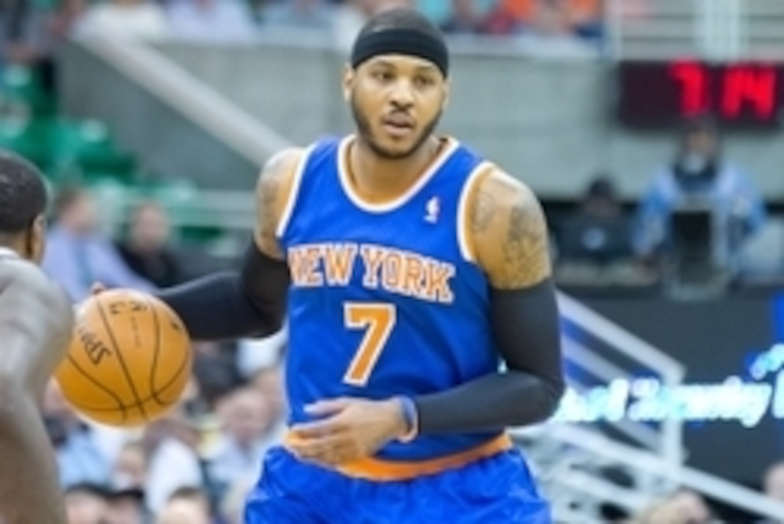 Mar 31, 2014; Salt Lake City, UT, USA; New York Knicks forward Carmelo Anthony (7) dribbles the ball during the first quarter against the Utah Jazz at EnergySolutions Arena. Mandatory Credit: Russ Isabella-USA TODAY Sports