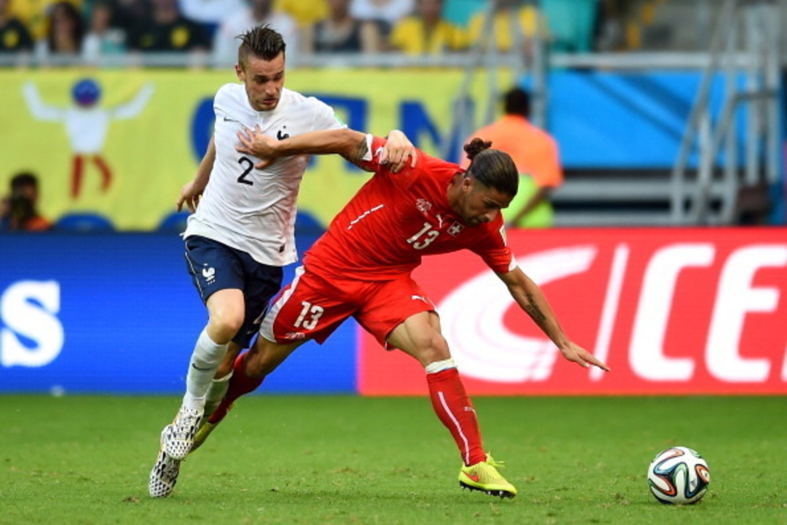 SALVADOR, BRAZIL - JUNE 20: Ricardo Rodriguez of Switzerland fights off Mathieu Debuchy of France during the 2014 FIFA World Cup Brazil Group E match between Switzerland and France at Arena Fonte Nova on June 20, 2014 in Salvador, Brazil. (Photo by Chr SALVADOR, BRAZIL - JUNE 20: Ricardo Rodriguez of Switzerland fights off Mathieu Debuchy of France during the 2014 FIFA World Cup Brazil Group E match between Switzerland and France at Arena Fonte Nova on June 20, 2014 in Salvador, Brazil. (Photo by Chr