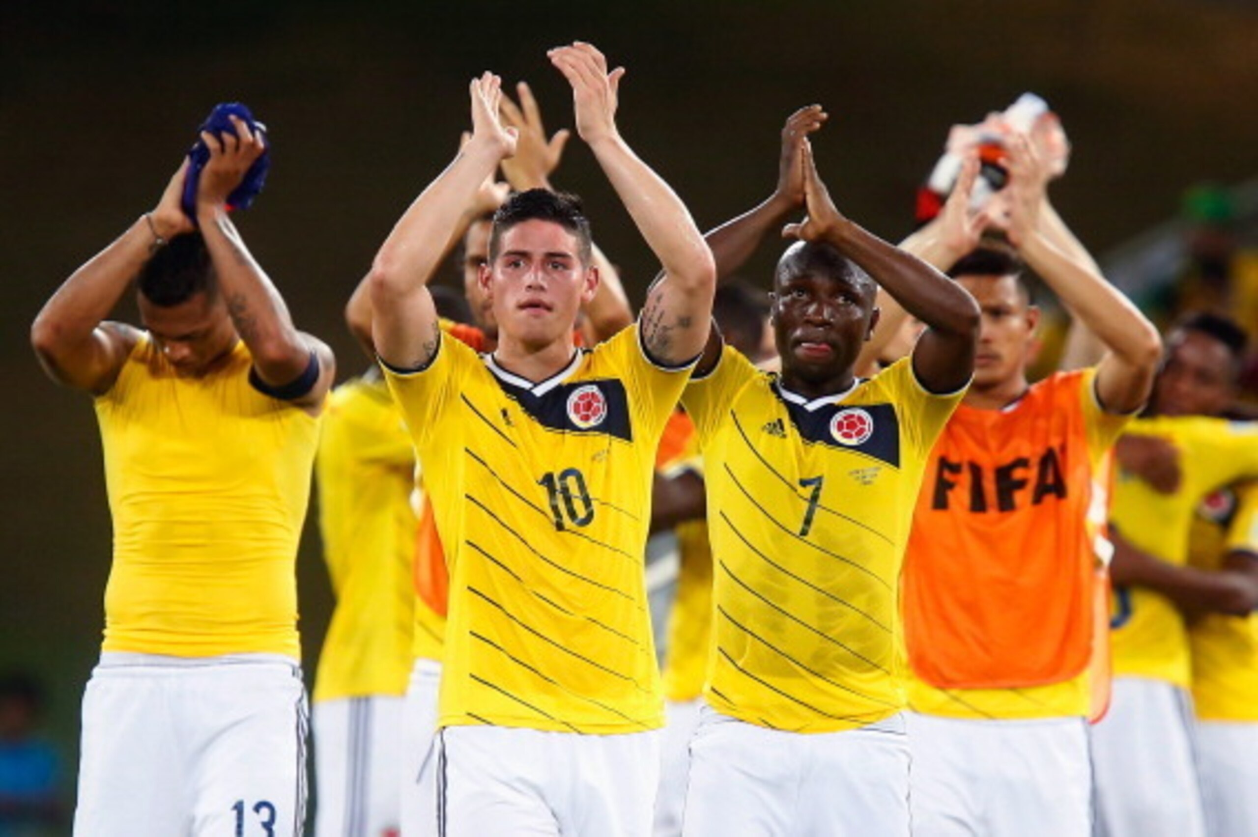 CUIABA, BRAZIL - JUNE 24: James Rodriguez (L) and Pablo Armero (R) of Colombia acknowledge the fans after the 2014 FIFA World Cup Brazil Group C match between Japan and Colombia at Arena Pantanal on June 24, 2014 in Cuiaba, Brazil. (Photo by Gabriel Ros CUIABA, BRAZIL - JUNE 24: James Rodriguez (L) and Pablo Armero (R) of Colombia acknowledge the fans after the 2014 FIFA World Cup Brazil Group C match between Japan and Colombia at Arena Pantanal on June 24, 2014 in Cuiaba, Brazil. (Photo by Gabriel Ros