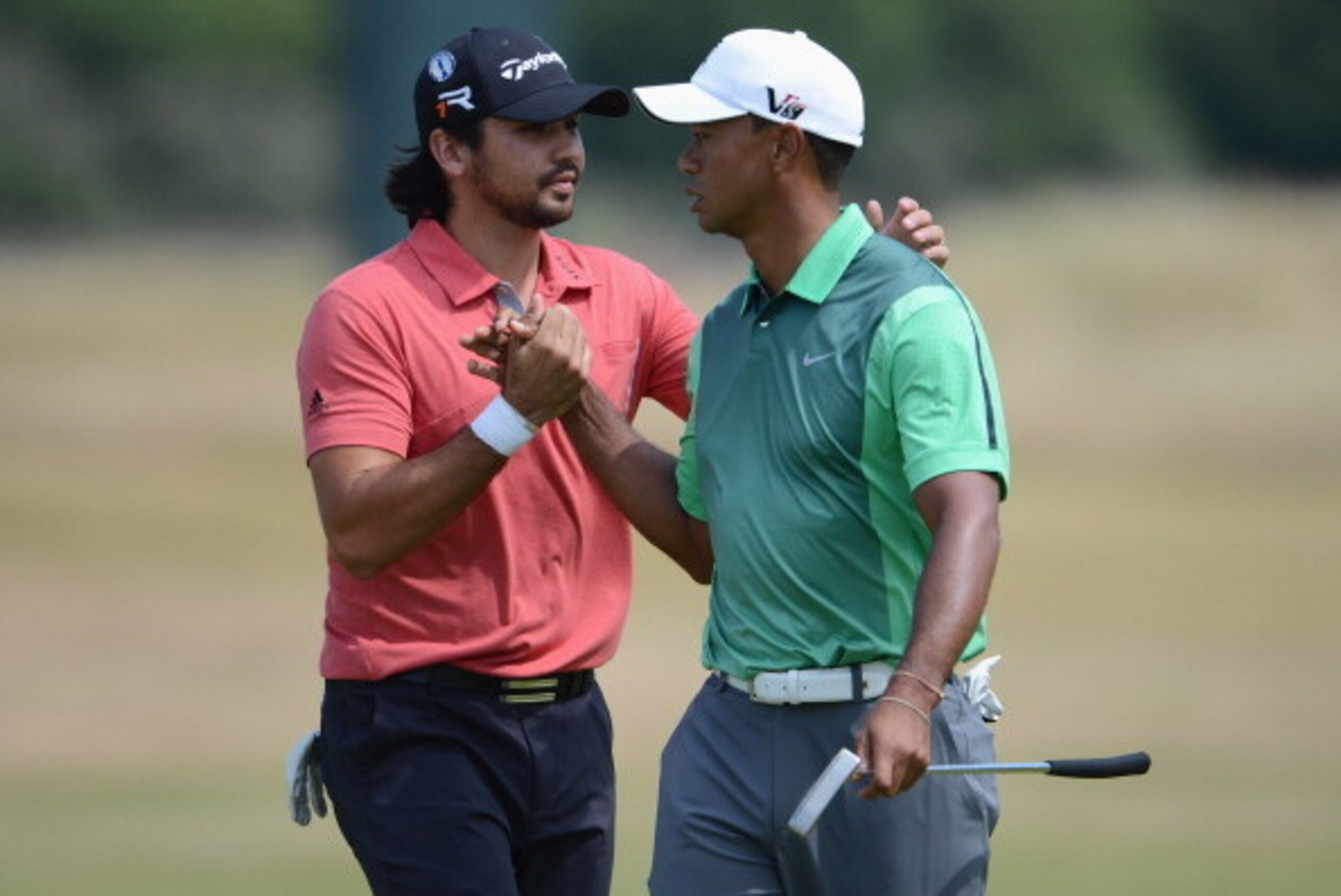 GULLANE, SCOTLAND - JULY 14:  Tiger Woods of the USA and Jason Day of Australia during a practise day for the 142nd Open Championship at Muirfield on July 14, 2013 in Gullane, Scotland.  (Photo by David Cannon/Getty Images)