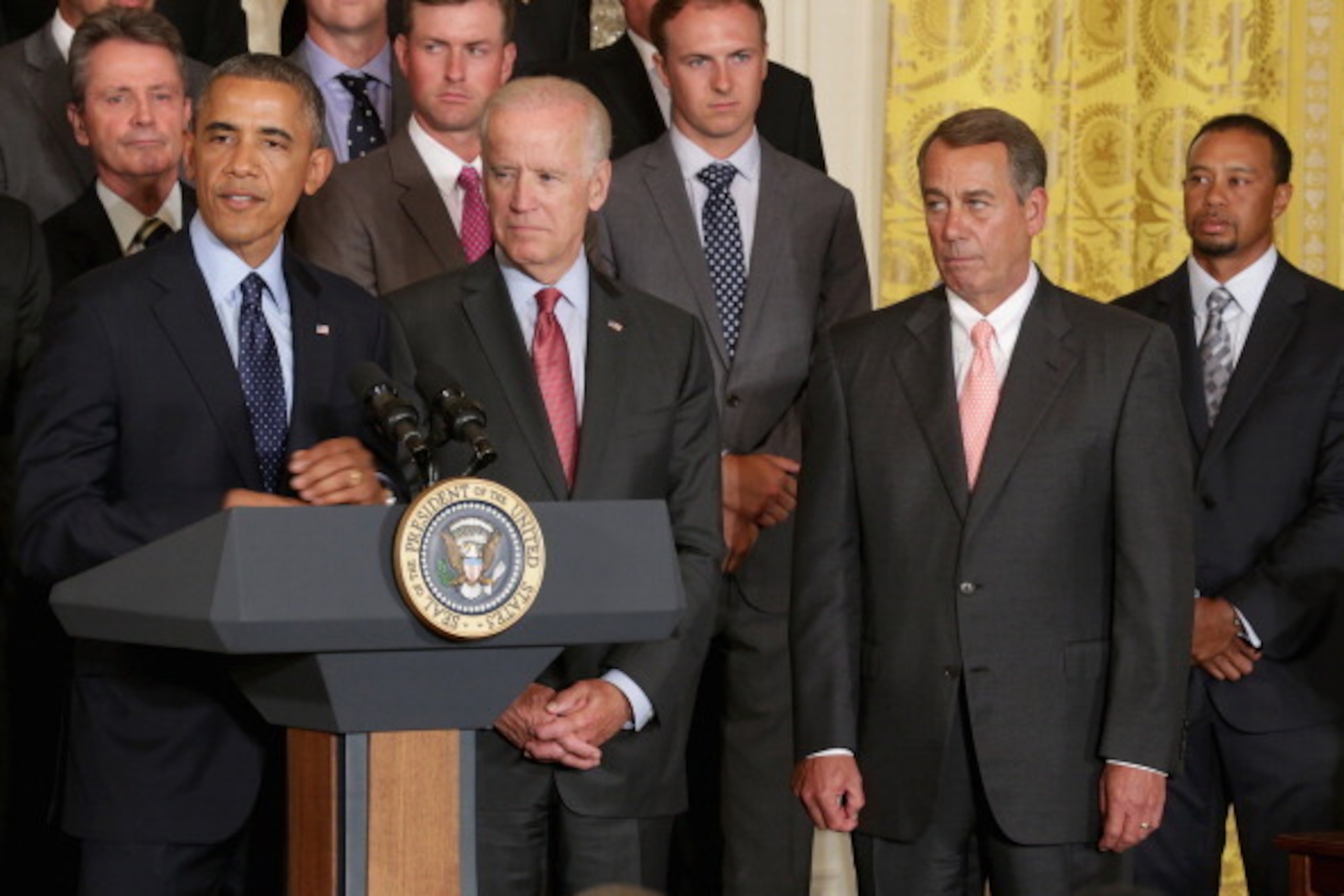 WASHINGTON, DC - JUNE 24:  (L-R) U.S. President Barack Obama, Vice President Joe Biden, Speaker of the House John Boehner (R-OH) and Tiger Woods celebrate the the 2013 Presidents Cup American and International golf teams in the East Room of the White Hous