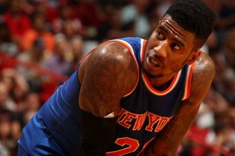 MIAMI, FL - April 6: Iman Shumpert #21 of the New York Knicks looks on during the game against the Miami Heat at the American Airlines Arena in Miami, Florida on April 6, 2014. NOTE TO USER: User expressly acknowledges and agrees that, by downloading and/